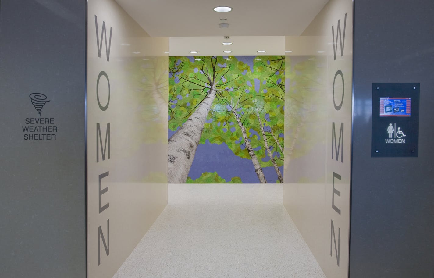 A prototype women's room on Concourse E at Minneapolis-St. Paul International Airport includes a ceramic mosaic by Barbara Keith.