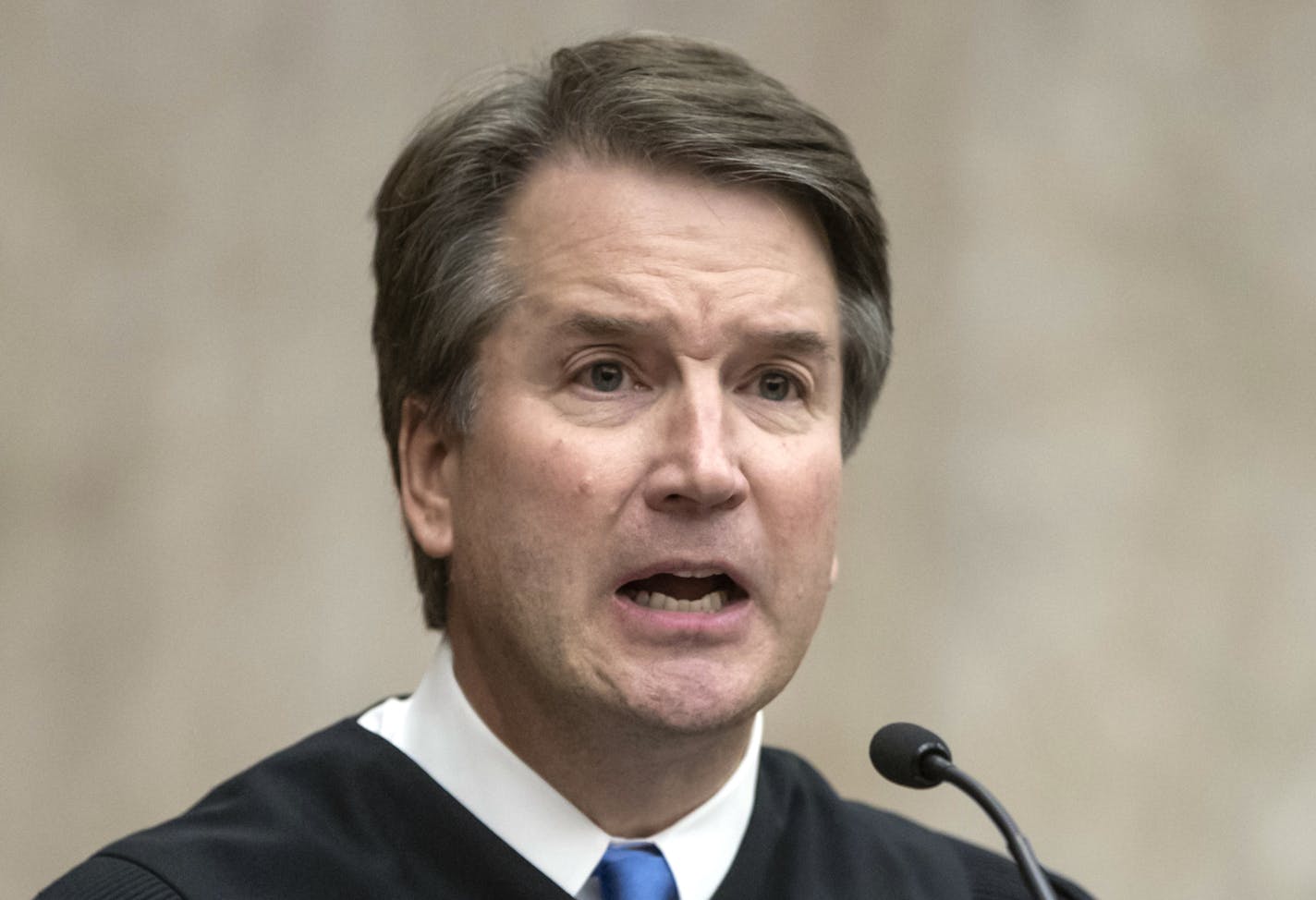 President Donald Trump's Supreme Court nominee, Judge Brett Kavanaugh, officiates at the swearing-in of Judge Britt Grant to take a seat on the U.S. Court of Appeals for the Eleventh Circuit, Tuesday, Aug. 7, 2018, at the U.S. District Courthouse in Washington. (AP Photo/J. Scott Applewhite)