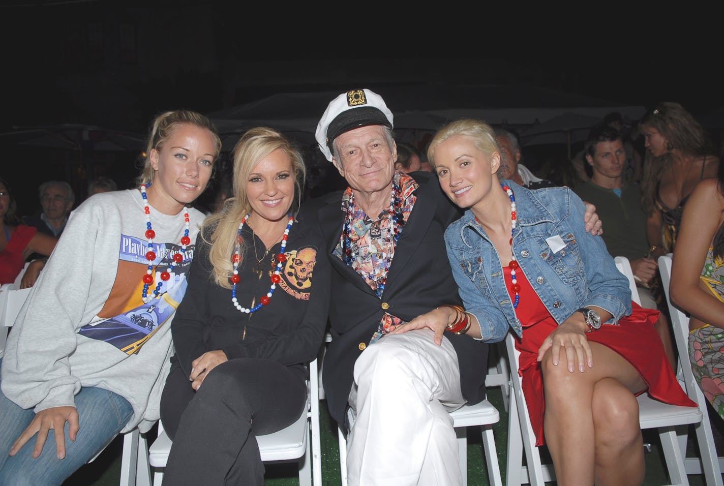 Kendra Wilkinson, Bridget Marquardt, Hugh Hefner and Holly Madison watch the fireworks at the Playboy Mansion July 4th party on "The Girls Next Door," about Hefner and his three girlfriends.