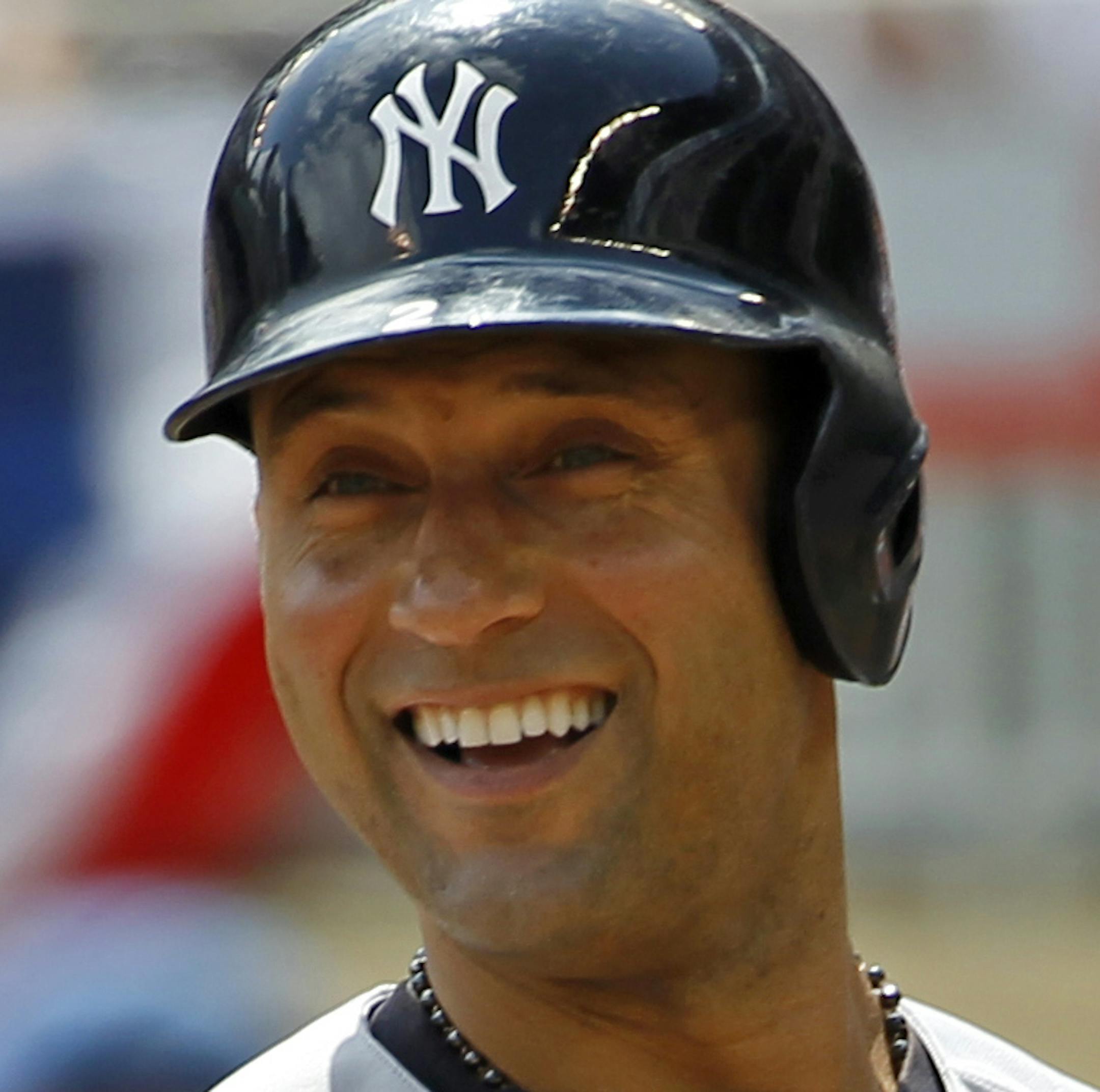 New York Yankees' Derek Jeter looks to third base coach Rob Thomson during the first inning of a baseball game against the Minnesota Twins in Minneapolis, Sunday, July 6, 2014. (AP Photo/Ann Heisenfelt)