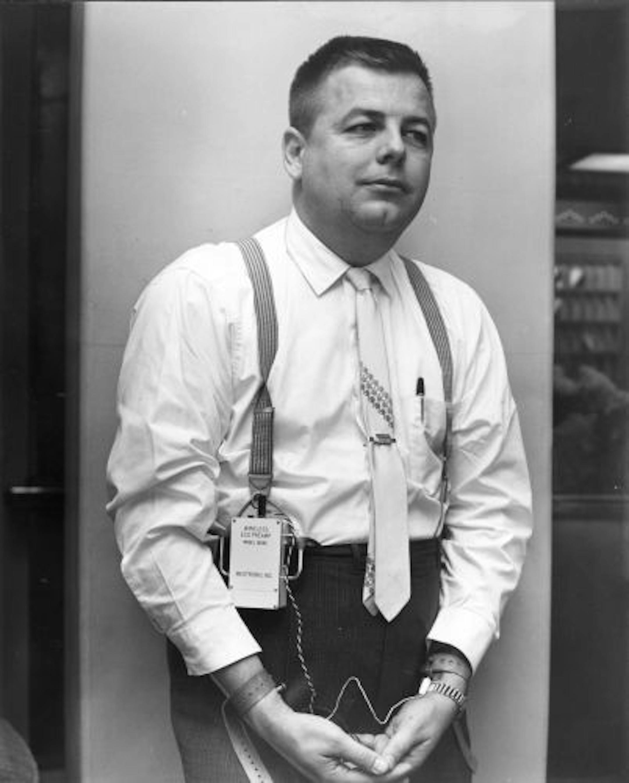 Earl Bakken and his invention, a pacemaker, in 1962.