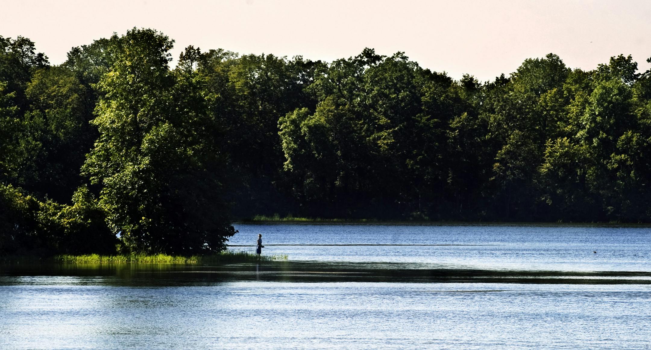 DAVID BREWSTER &#xef; dbrewster@startribune.com Tuesday 08/17/10 Prior Lake The large west suburban park district which at one time was known as Hennepin Parks is looking to expand its empire by taking over operation of Scott County Parks -without adding taxing authority in Scott County. Looking at what's in it for the Hennepin County taxpayer. IN THIS PHOTO: Fishing on Cleary Lake in Prior Lake Tuesday afternoon.