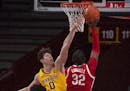Gophers center Liam Robbins defended the rim against Buckeyes forward E.J. Liddell in the second half Sunday.