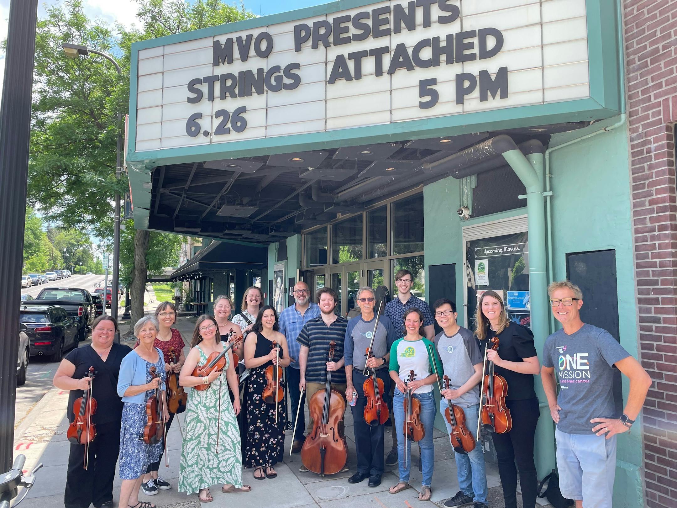 Mississippi Valley Orchestra Crewtet standing beneath the Parkway Theater marquee in June 2024.
