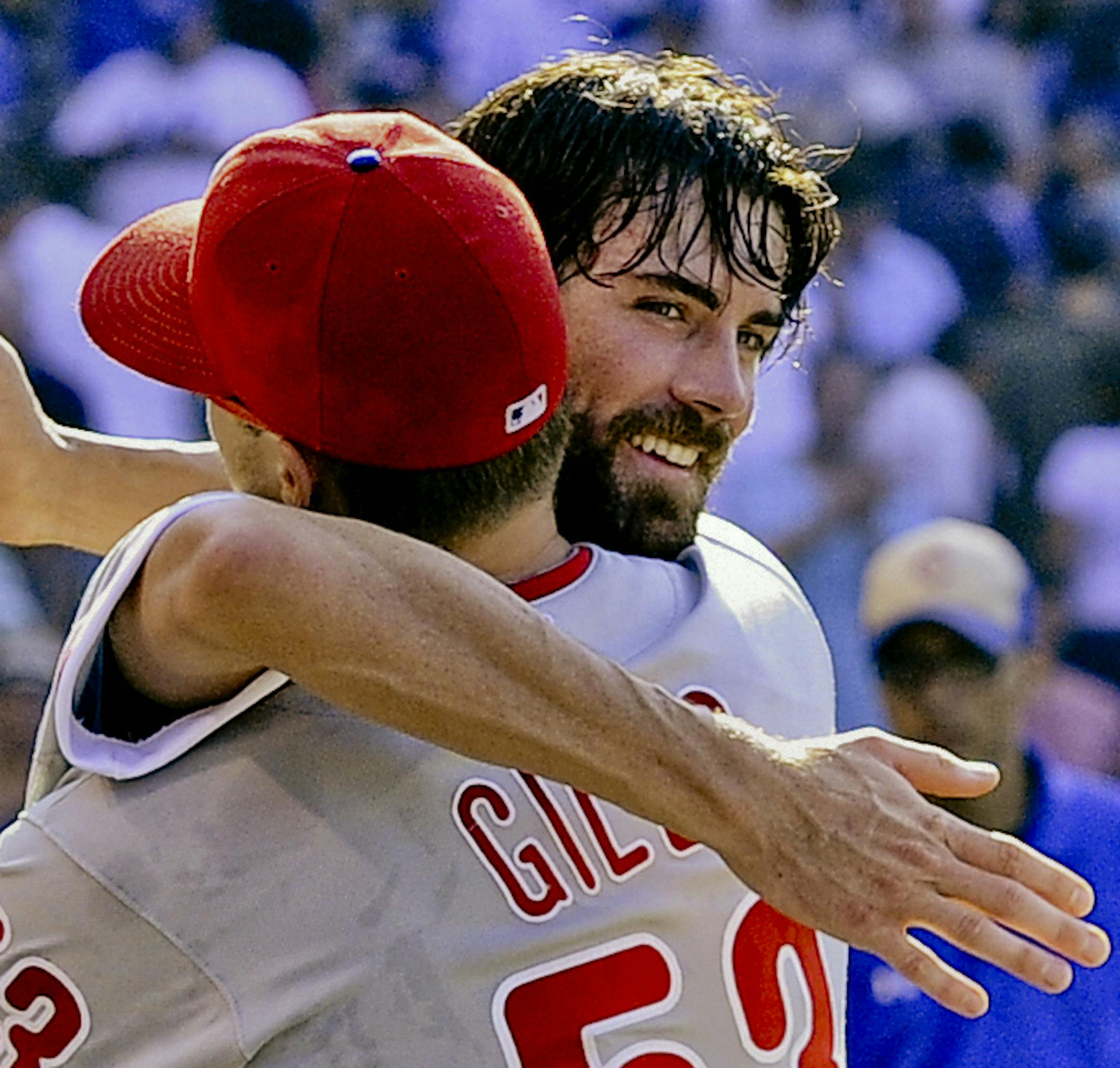 Philadelphia Phillies pitcher Cole Hamels, left, hugs pitcher Ken Giles after pitching a no-hitter against the Chicago Cubs during a baseball game in Chicago, Saturday, July 25, 2015. The Phillies won 5-0. (AP Photo/Matt Marton) ORG XMIT: MIN2015083119021650
