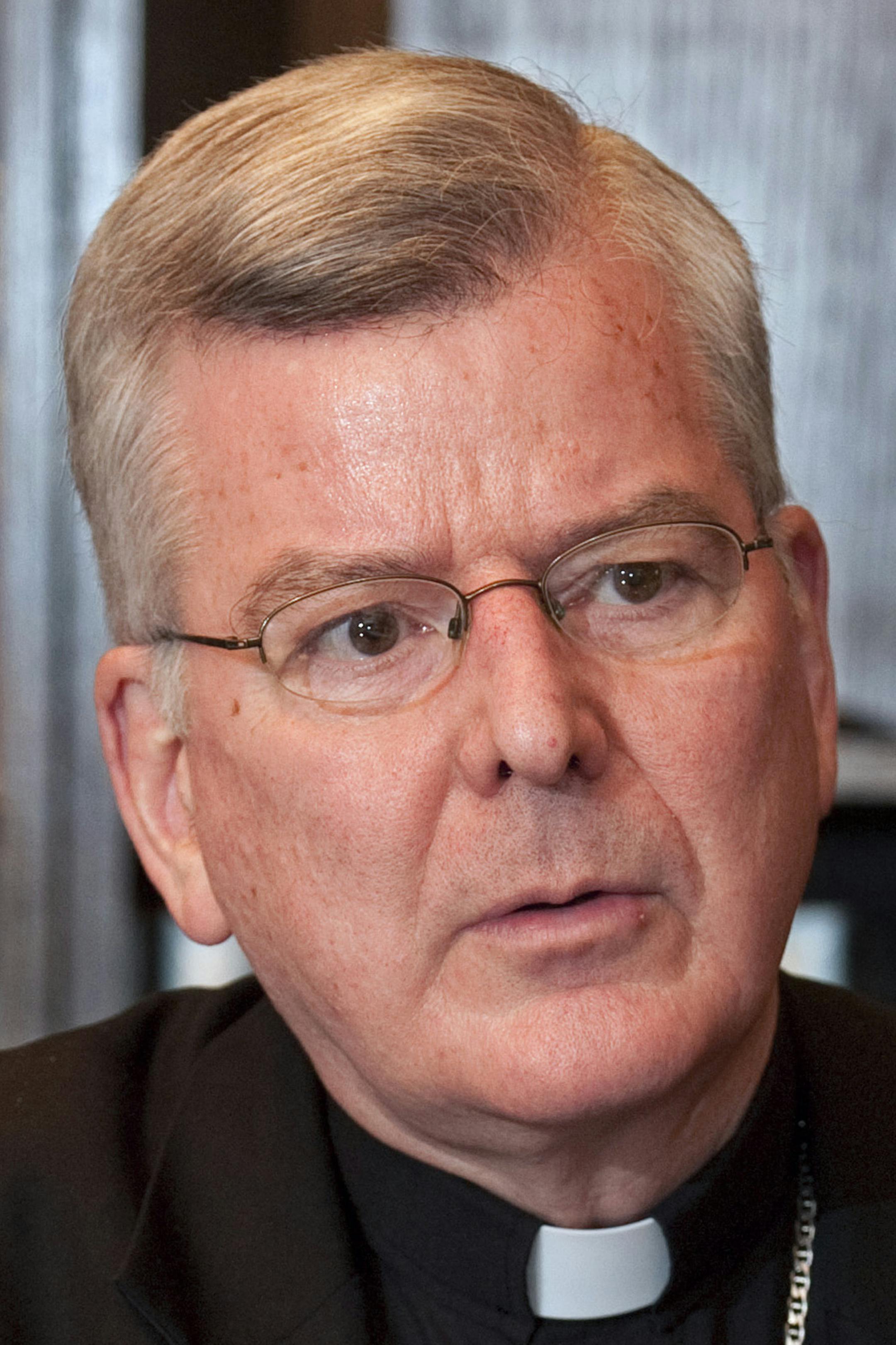 FILE - In this Oct. 21, 2010 file photo is Archbishop John C. Nienstedt in St. Paul, Minn. Nienstedt said Monday Nov. 11, 2013, in an open letter that The Archdiocese of St. Paul and Minneapolis that the archdiocese this month will release the names of some priests who have sexually abused children √≥ a disclosure necessary to correct "serious mistakes" made in the handling of such cases. (AP Photo/Craig Lassig, File) ORG XMIT: MIN2013121421352947