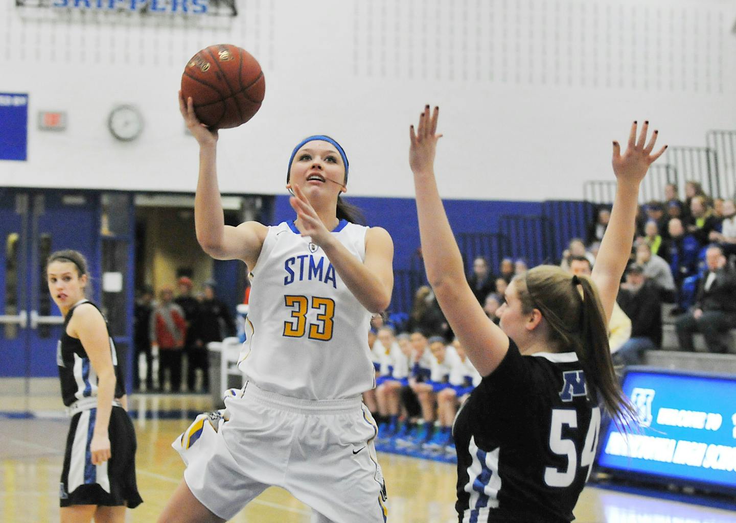 St. Michael-Albertville forward Sydney Tracy, shown here playing against Minnetonka, scored her 1,000th career point earlier this month.