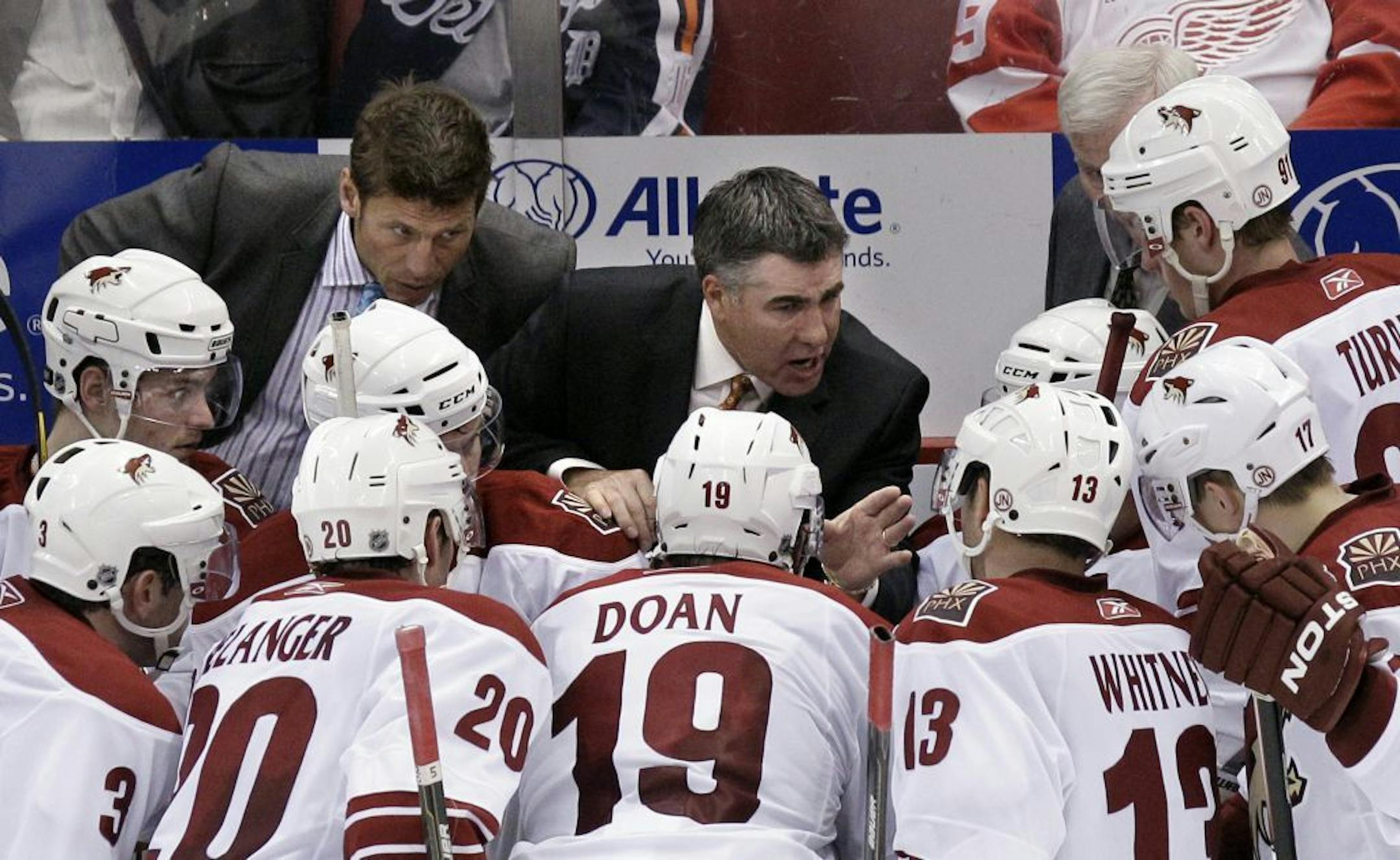 Phoenix Coyotes coach Dave Tippett talks to his team during a timeout in the third period in Game 1 of a first-round NHL hockey playoff series against the Detroit Red Wings in Detroit, Wednesday, April 13, 2011. Detroit won 4-2.
