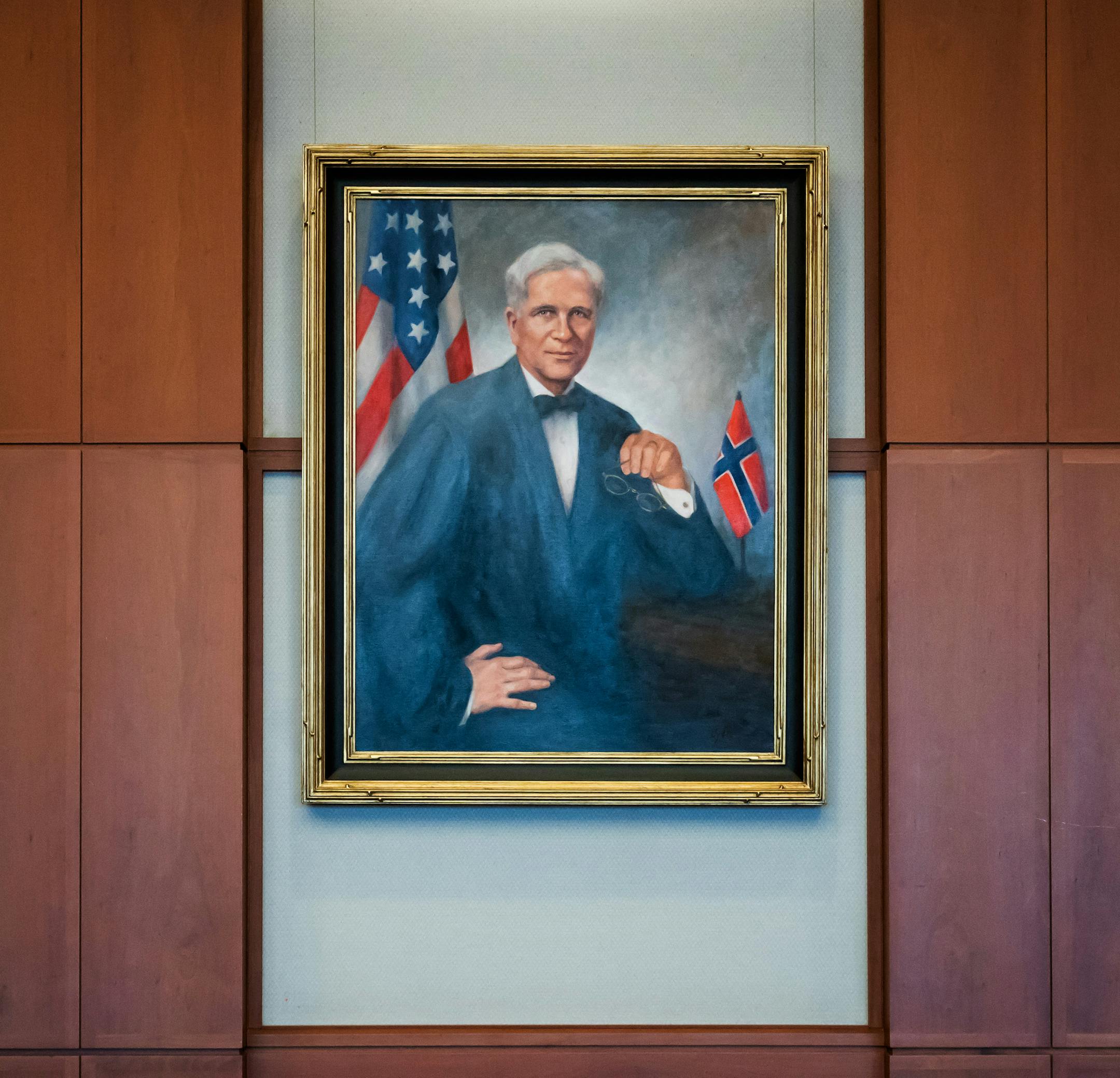 Grandaughter of Gunnar Nordbye Andrea Bassett and and great-great grandson of Gunnar Nordbye Gunnar Bassett with the judge's newly hung portrait in the Chief Judges chamber on the 15th floor of the Minneapolis federal courthouse. Nordbye's portrait now hang in the courtroom where Chief Judge John Tunheim presides. ] GLEN STUBBE ï glen.stubbe@startribune.com Friday, July 27, 2018