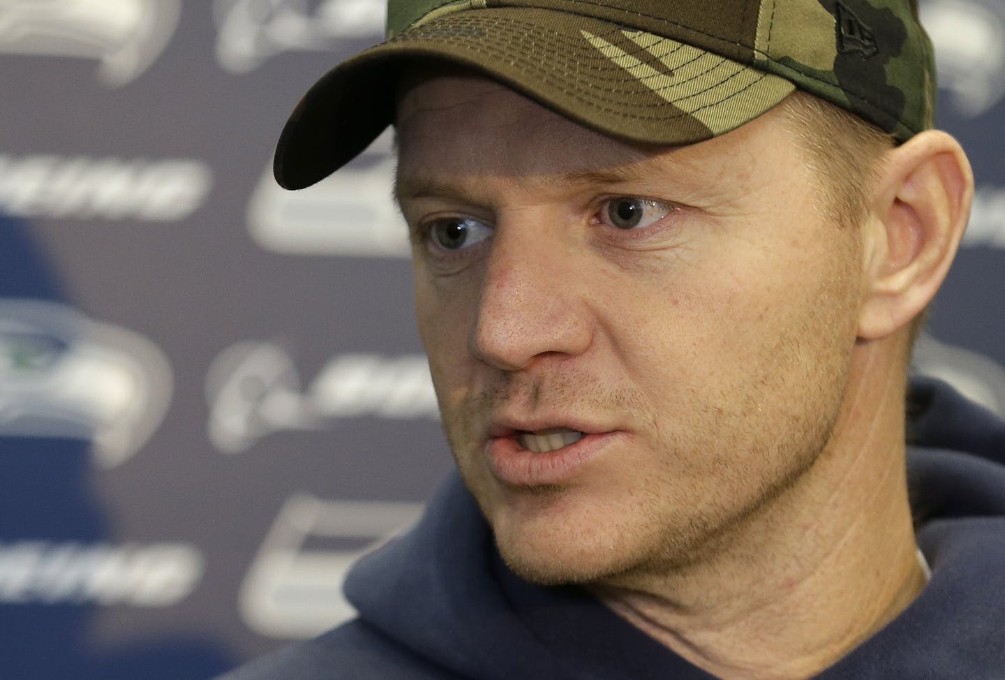 Seattle Seahawks offensive coordinator Darrell Bevell talks to reporters on Wednesday, Jan. 15, 2014, after NFL football practice in Renton, Wash. The Seahawks are to play the San Francisco 49ers on Sunday in the NFC championship. (AP Photo/Ted S. Warren) ORG XMIT: MIN2014011617032072