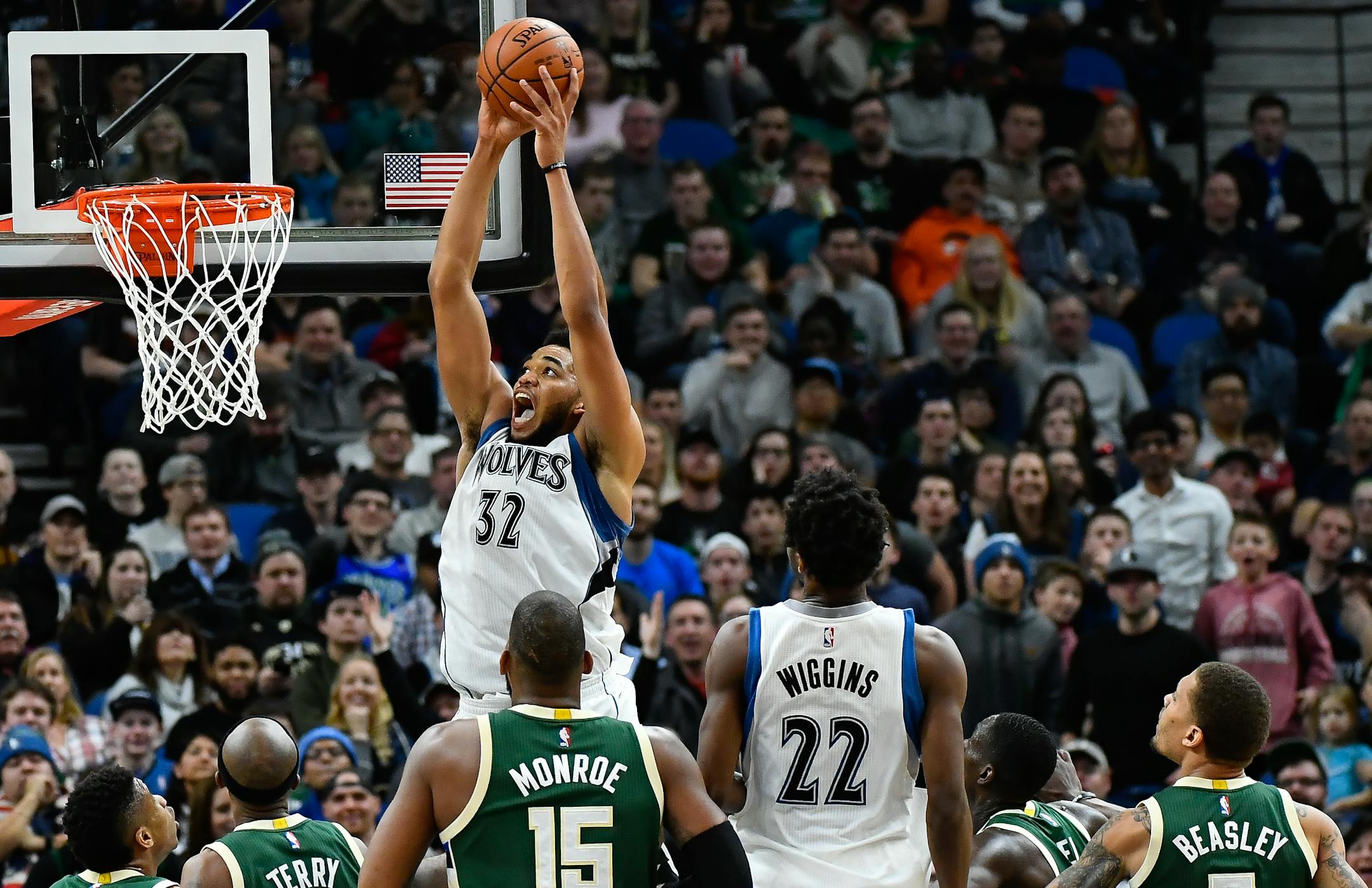 Karl-Anthony Towns (32) dunks against the Milwaukee Bucks on Friday, Dec. 30, 2016, at Target Center