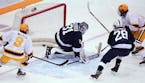 Gophers center Scott Reedy (19) took a shot and scored on Penn State goaltender Liam Souliere (31) in the first period.