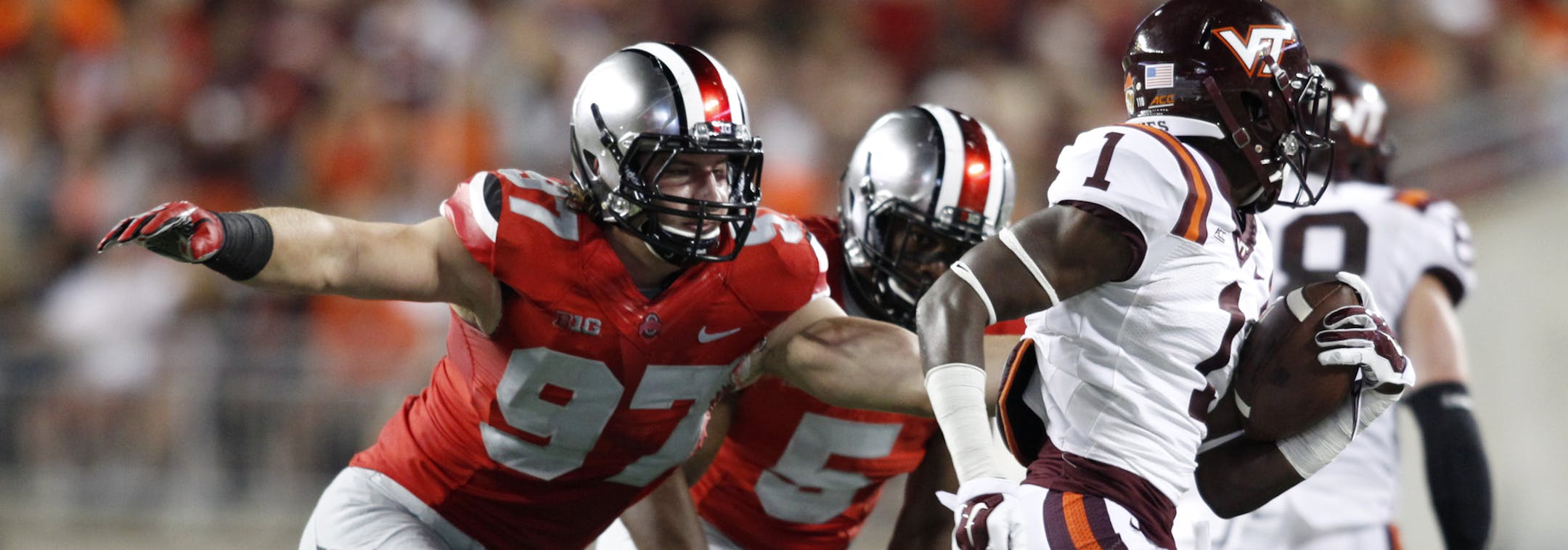Ohio State lineman Joey Bosa (97) and linebacker Raekwon McMillian (5) chase Virginia Tech receiver Isaiah Ford (1) during an NCAA college football game Saturday, Sept. 6, 2014, in Columbus, Ohio. Virginia Tech won 35-21. (AP Photo/Paul Vernon) ORG XMIT: NYOTK