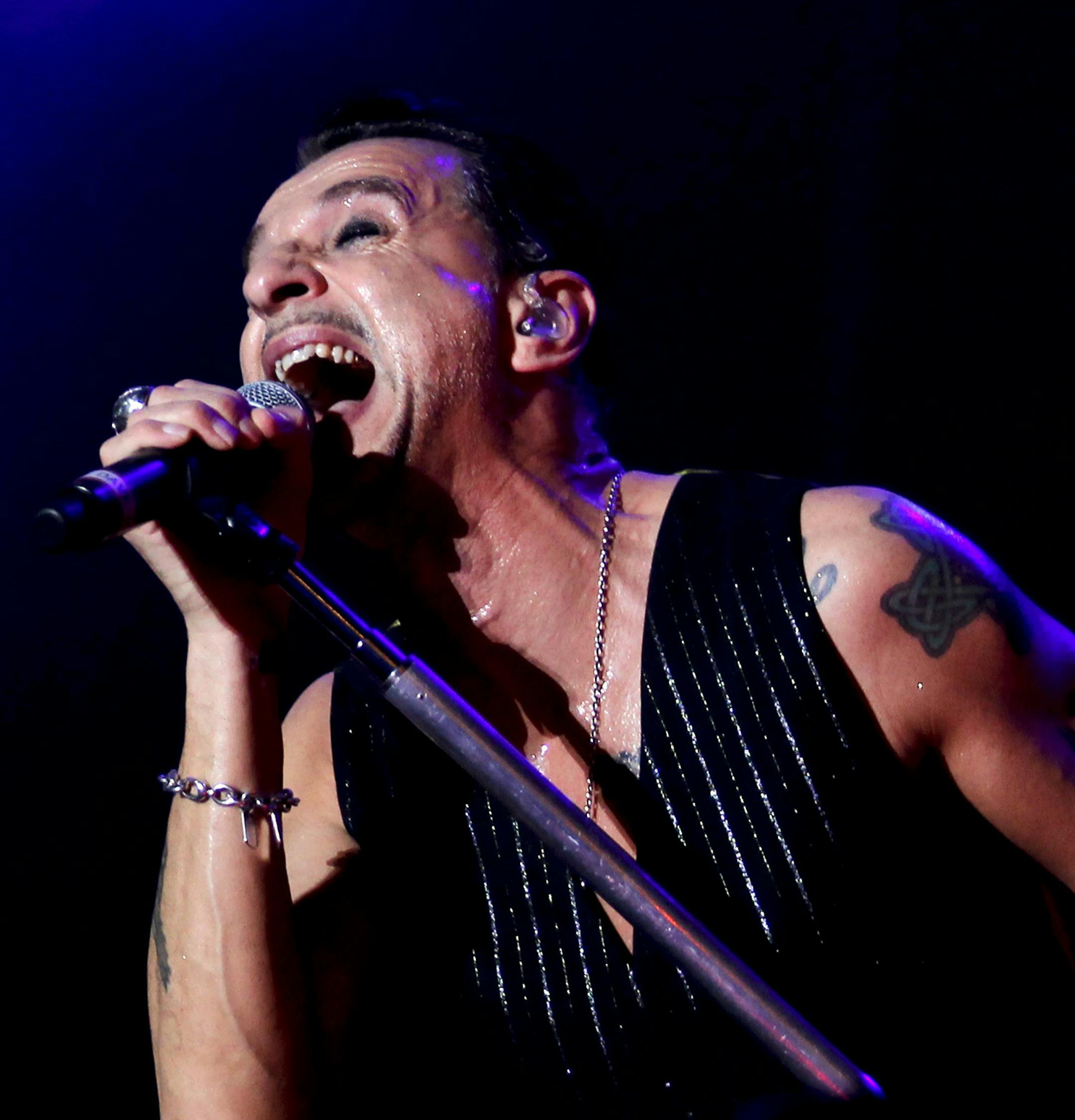 Lead singer Dave Gahan, right, and Martin Gore, of the British music band Depeche Mode, perform during their concert at the Optimus Alive music festival in Lisbon, Portugal Saturday, July 13, 2013. (AP Photo/Francisco Seco)