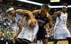 Tamika Catchings and Maya Moore fought for possession during the 2012 WNBA Finals.