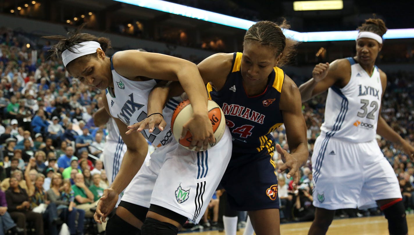 Tamika Catchings and Maya Moore fought for possession during the 2012 WNBA Finals.