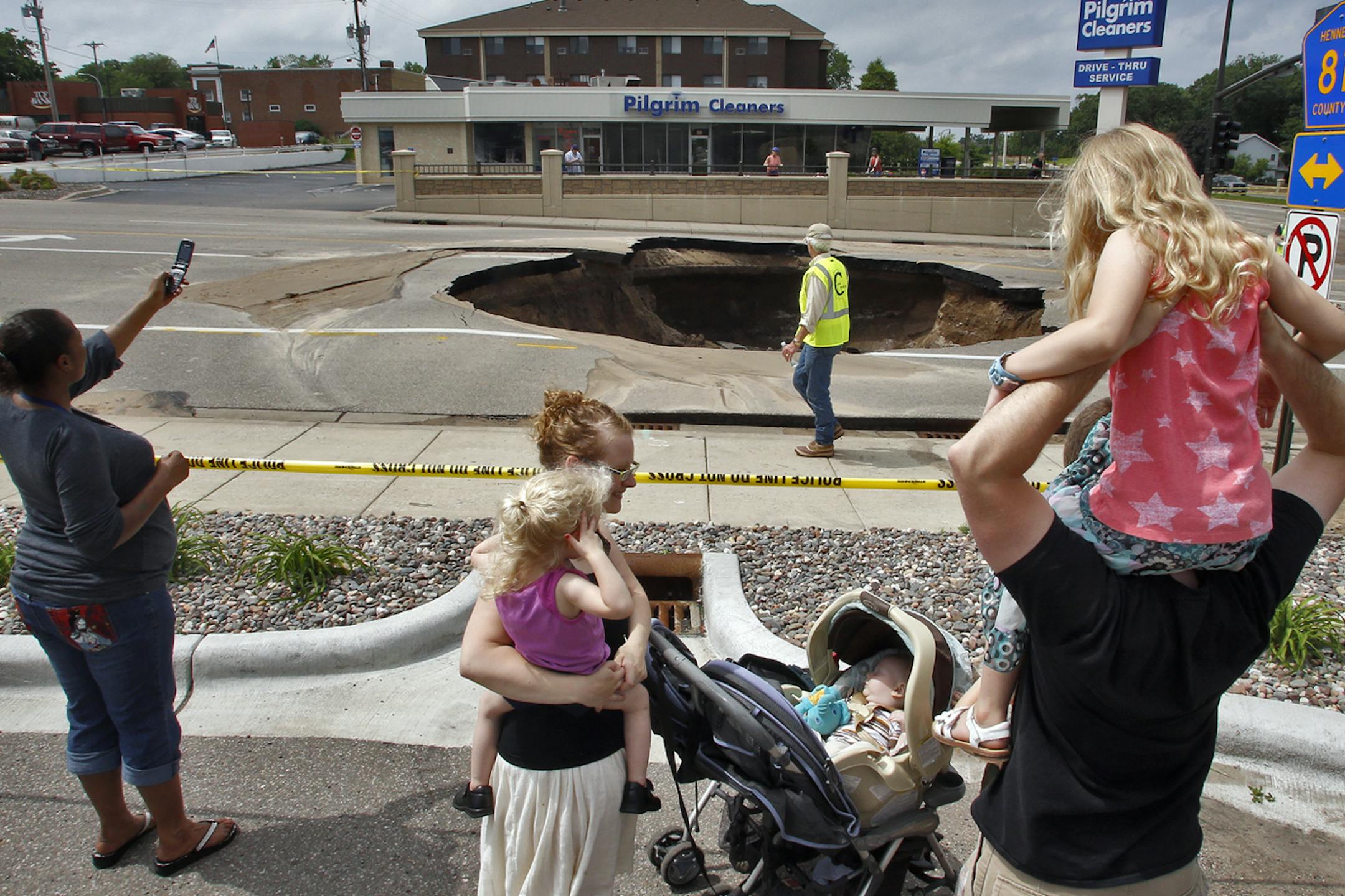 The Twin Cities’ frustration was compounded by a sinkhole caused by a water main break in downtown Robbinsdale, drawing workers and gawkers.