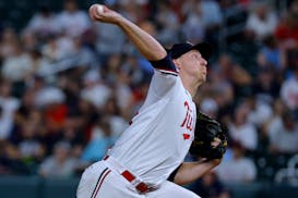 Minnesota Twins relief pitcher Josh Winder throws to a Texas Rangers batter during the eighth inning of a baseball game Thursday, Aug. 24, 2023, in Mi