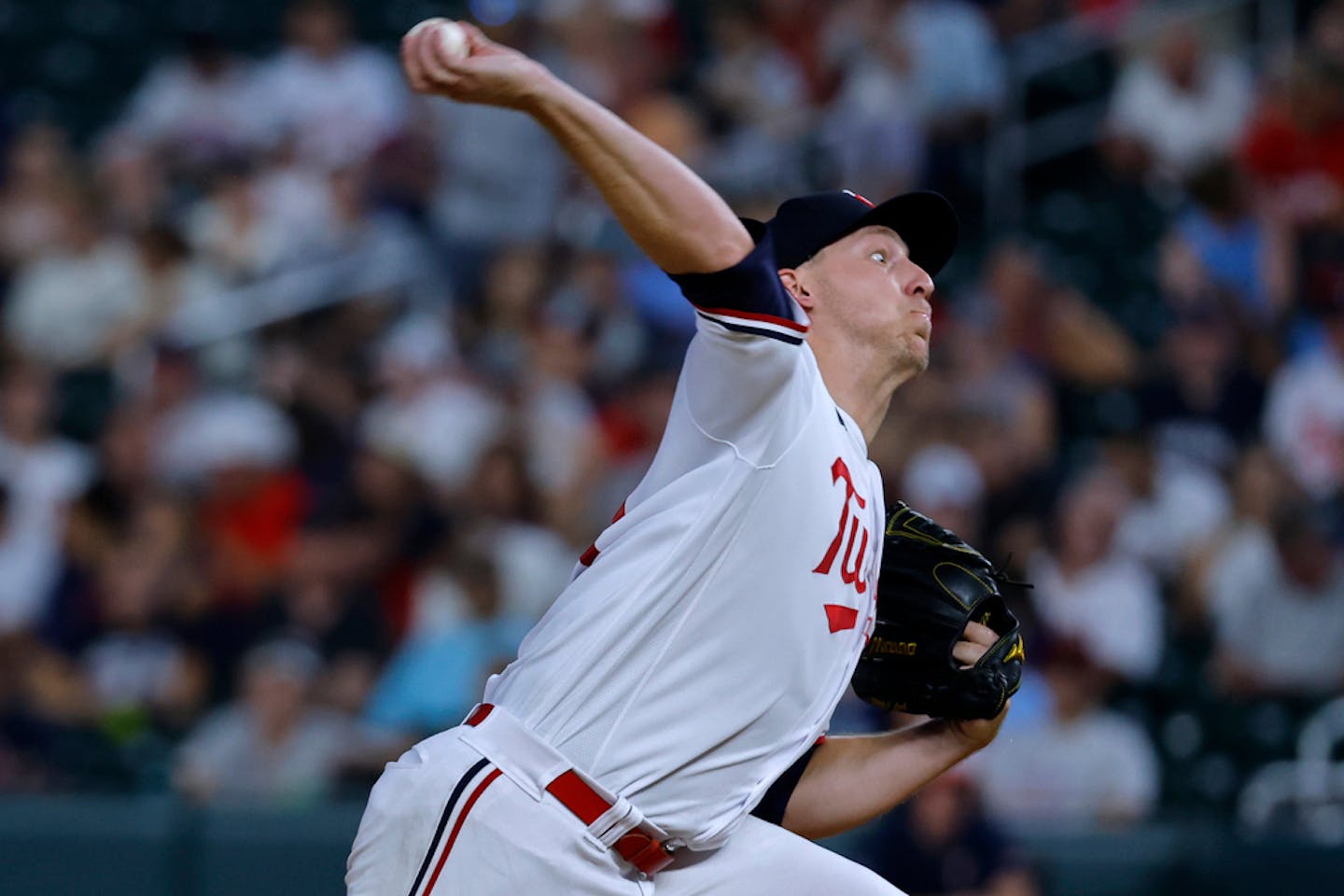 Minnesota Twins relief pitcher Josh Winder throws to a Texas Rangers batter during the eighth inning of a baseball game Thursday, Aug. 24, 2023, in Minneapolis. (AP Photo/Bruce Kluckhohn)