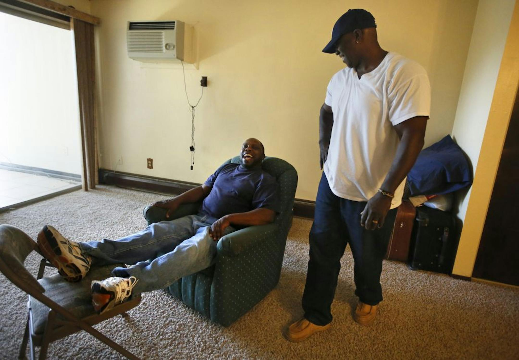 For Gino Nelson, right, of St. Stephen's Human Services, a visit to Vietnam War veteran Murien Jeffers at his new apartment in Burnsville was just part of a typical morning.