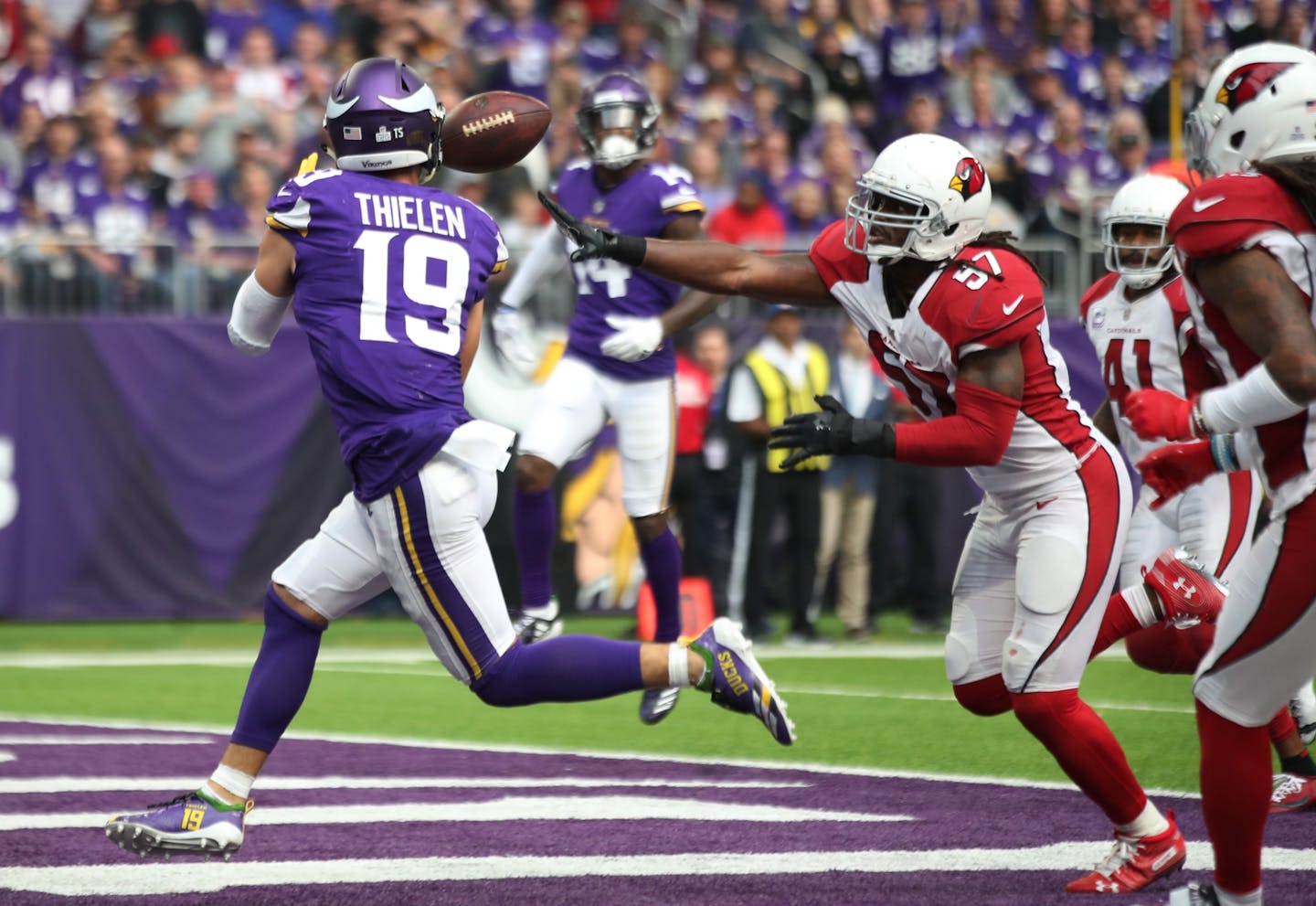 Minnesota Vikings wide receiver Adam Thielen (19) scored a third quarter touchdown over Arizona Cardinals linebacker Josh Bynes (57) at U.S. Bank Stadium Sunday October 14, 2018 in Minneapolis, MN.