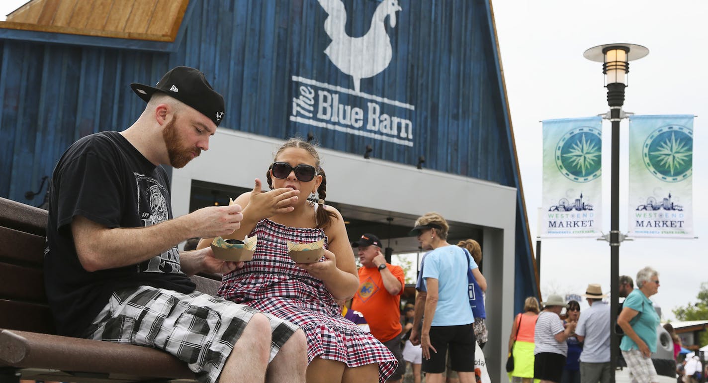 Among the new food establishments available to visitors to the Minnesota State Fair is the Blue Barn and seenThursday, Aug. 21, 2014 in Falcon Heights, MN. Sampling the corn and gorgonzola fritters were Jeremy Addison and his girlfriend Amber MacKenzie, who called the dish "awesome."] (DAVID JOLES/STARTRIBUNE) djoles@startribune Annual survey of new foods at the MN State Fair.**Jeremy Addison, Amber MacKenzie,cq