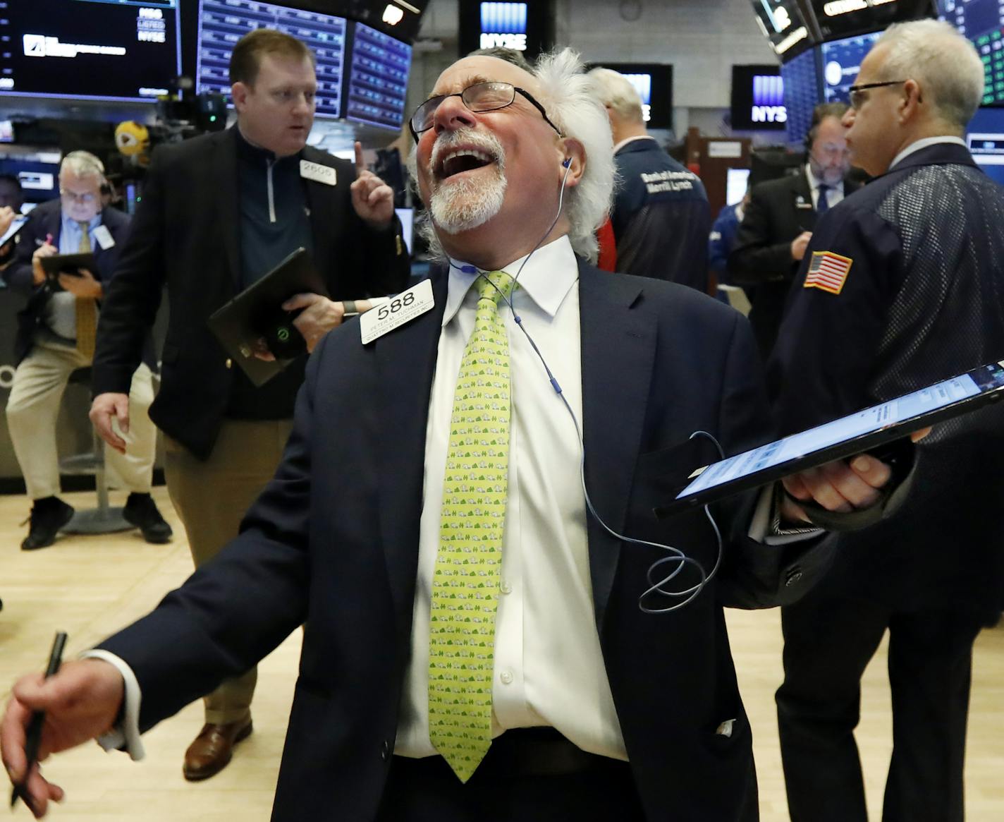 Trader Peter Tuchman laughs as he works on the floor of the New York Stock Exchange, Wednesday, March 13, 2019. U.S. stocks opened broadly higher on Wall Street Wednesday, powered by technology and health care companies, as the market pushes for its third straight day of gains. (AP Photo/Richard Drew)