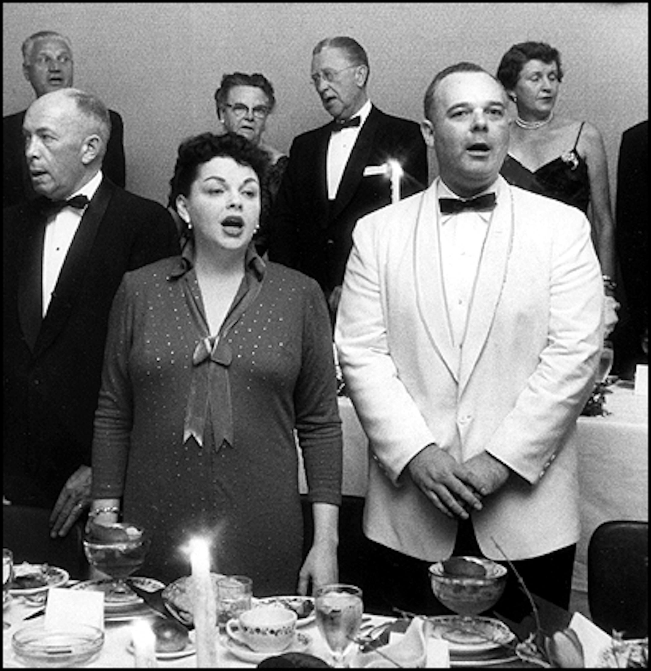 Published May 11, 1958: Minnesotans saluted 100 years at a centennial eve dinner Saturday. Singing the national anthem, front row from left, were Lt. Gov. Karl Rolvaag, Judy Garland and Robert Snook of the centennial committee. Back row, from left: Judge Luther W. YOungdahl, Mrs. J.L. Morrill and Dr. J.L. Morrill, and Mrs. Philip Pillsbury.