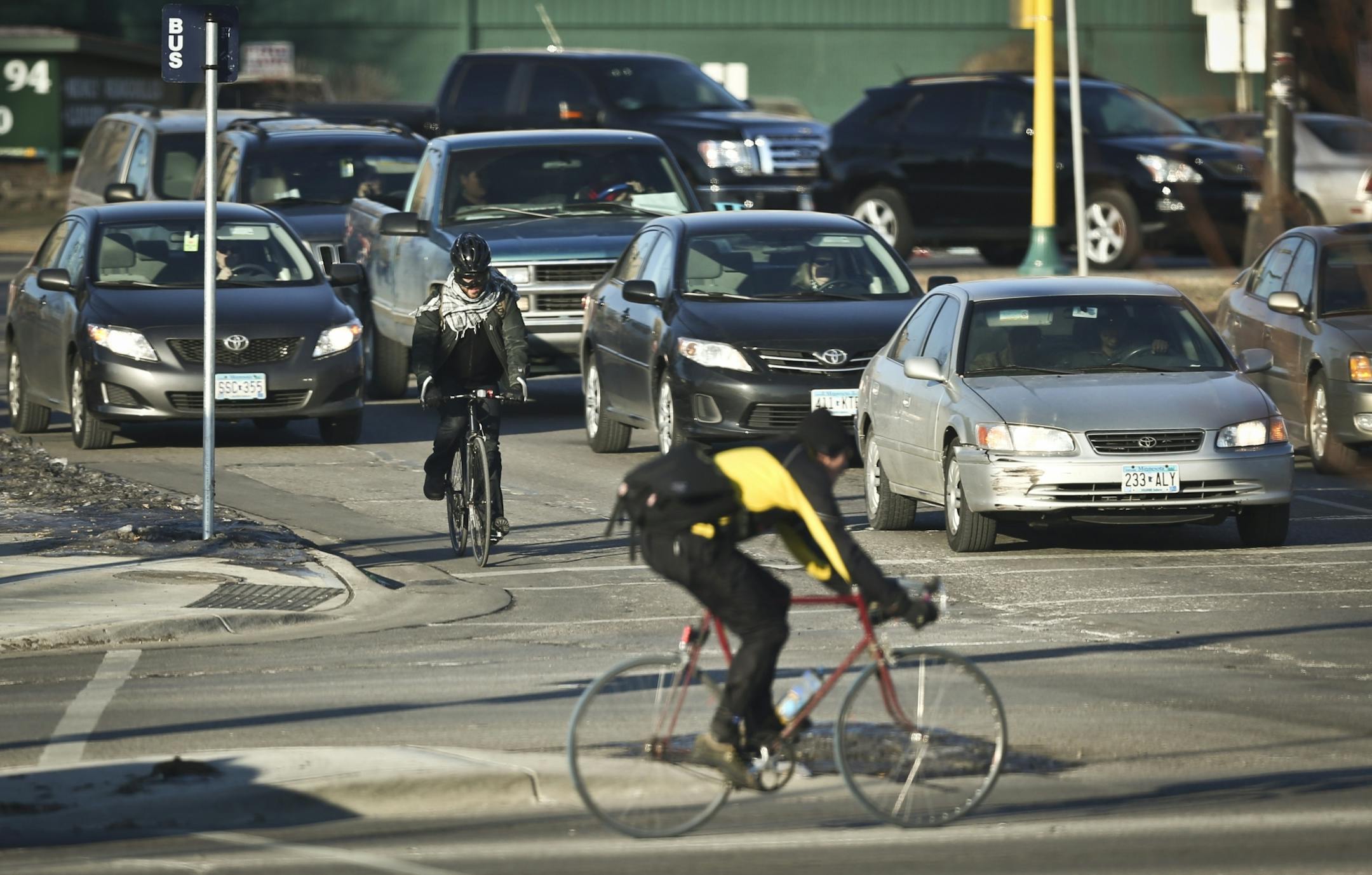 Bicyclists crossed Cedar Avenue and East Franklin Avenue in traffic on Tuesday, January 15, 2013, in Minneapolis, Minn. This intersection has had 20 bicycle/car crashes in the last ten years.