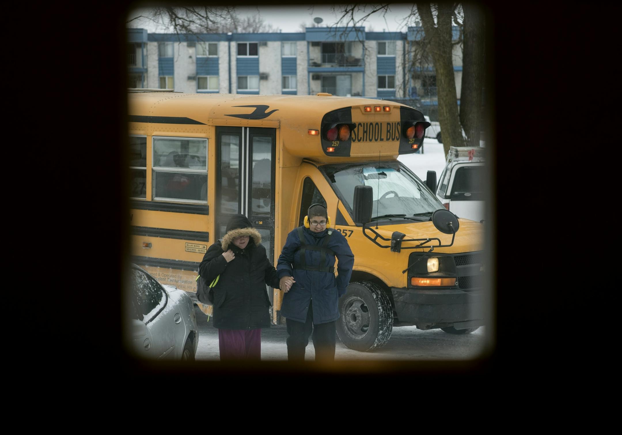 Cora Mustin meet her 15-year-old son Jordan Mustin at his bus stop in front of her apartment Thursday December 14, 2017 in Mounds View, MN. Jordan has autism and a history of violent outbursts toward himself and family.