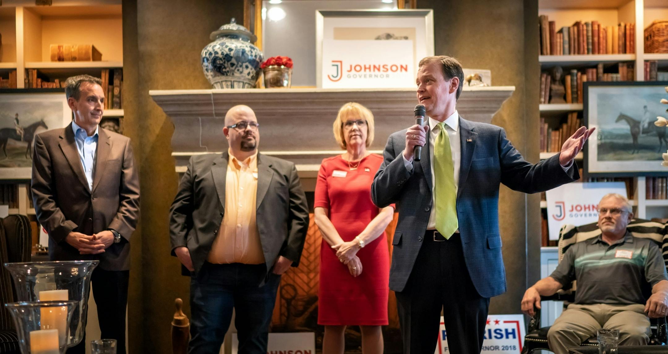 GOP gubernatorial candidate Jeff Johnson talked with delegates and voters at the Edina Country Club in Minnesota's third congressional district. Behind him are rivals Tim Pawlenty and Mary Giuliani Stephens with moderator Andrew Lee of KTLK.