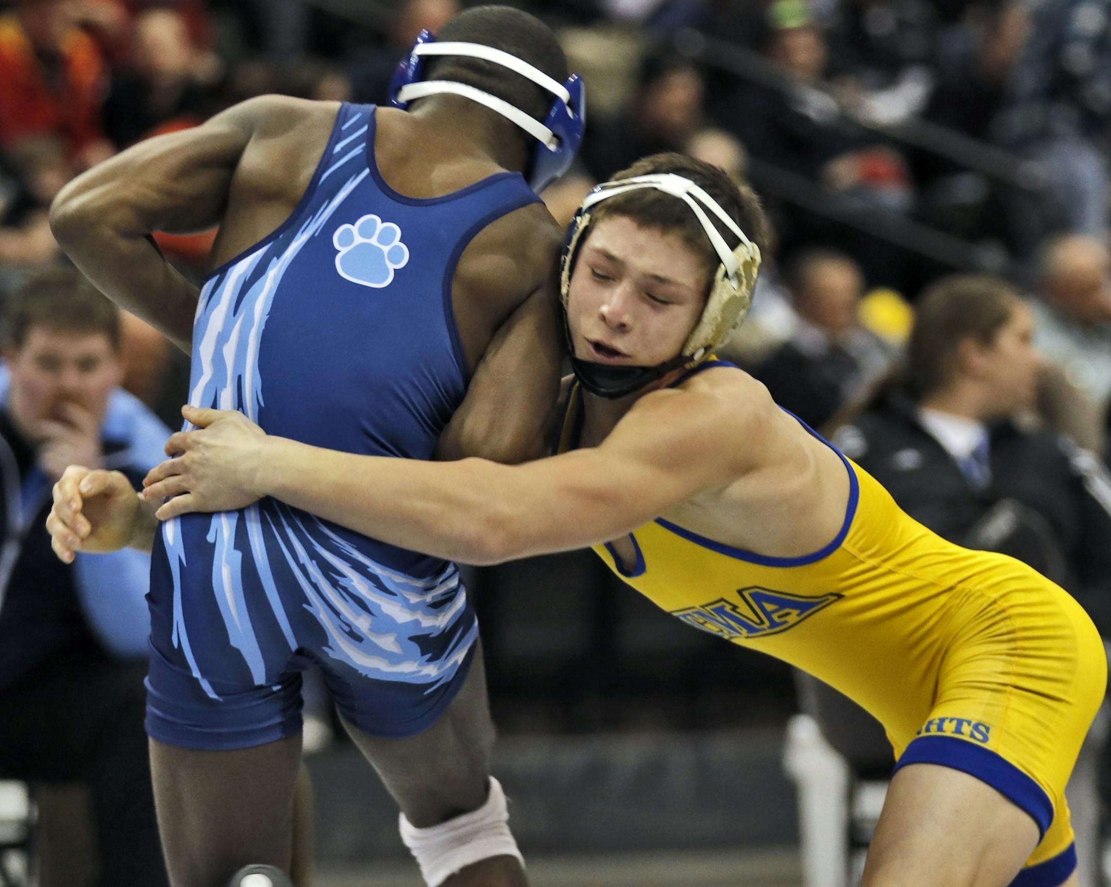 St. Michael-Albertville's Mitchell McKee, right, wrestled Blaine's Malik Stewart in the 3A 120 lb championship match. McKee won the match. [ Prep State Wrestling Individual Championships (MARLIN LEVISON/STARTRIBUNE