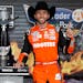 Chase Elliott celebrates in Victory Lane after winning the NASCAR Cup Series race at Texas Motor Speedway on Sunday in Fort Worth.
