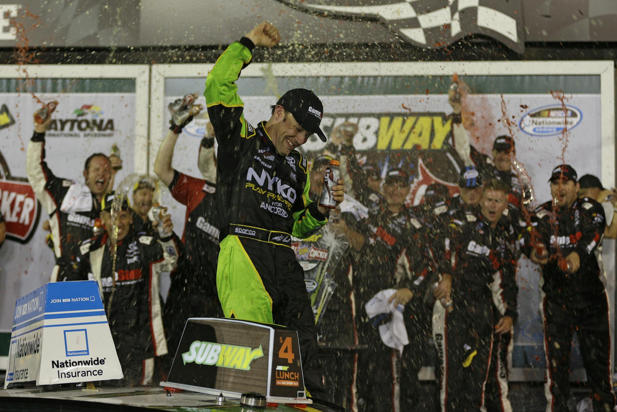Matt Kenseth celebrates in victory lane after winning the NASCAR Nationwide auto race at Daytona International Speedway, Friday, July 5, 2013, in Daytona Beach, Fla. (AP Photo/John Raoux)