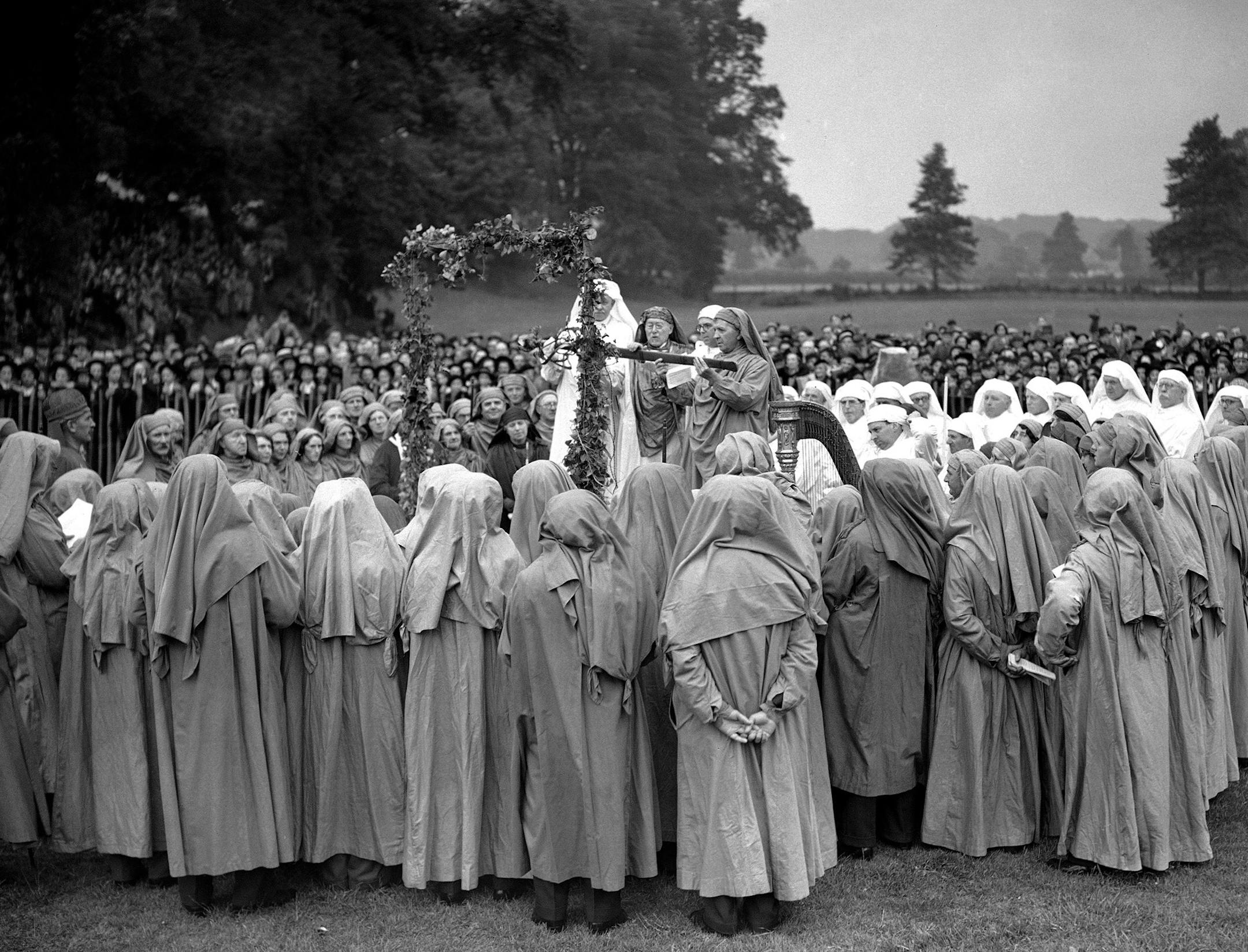 FILE - In this June 22, 1939 file photo, participants in a "Gorsedd," a group of poets and bards, announce the upcoming 1940 Welsh Eisteddfod cultural festival at Bridgend, Glamorganshire, Wales, at an ancient druid stone circle near the River Ogwar. In report released Thursday, March 19, 2015 in the journal Nature, genetic samples collected from across the United Kingdom are shedding light on the ancient past, including Viking invasions and a mystery about the arrival of the Anglo-Saxons. The D