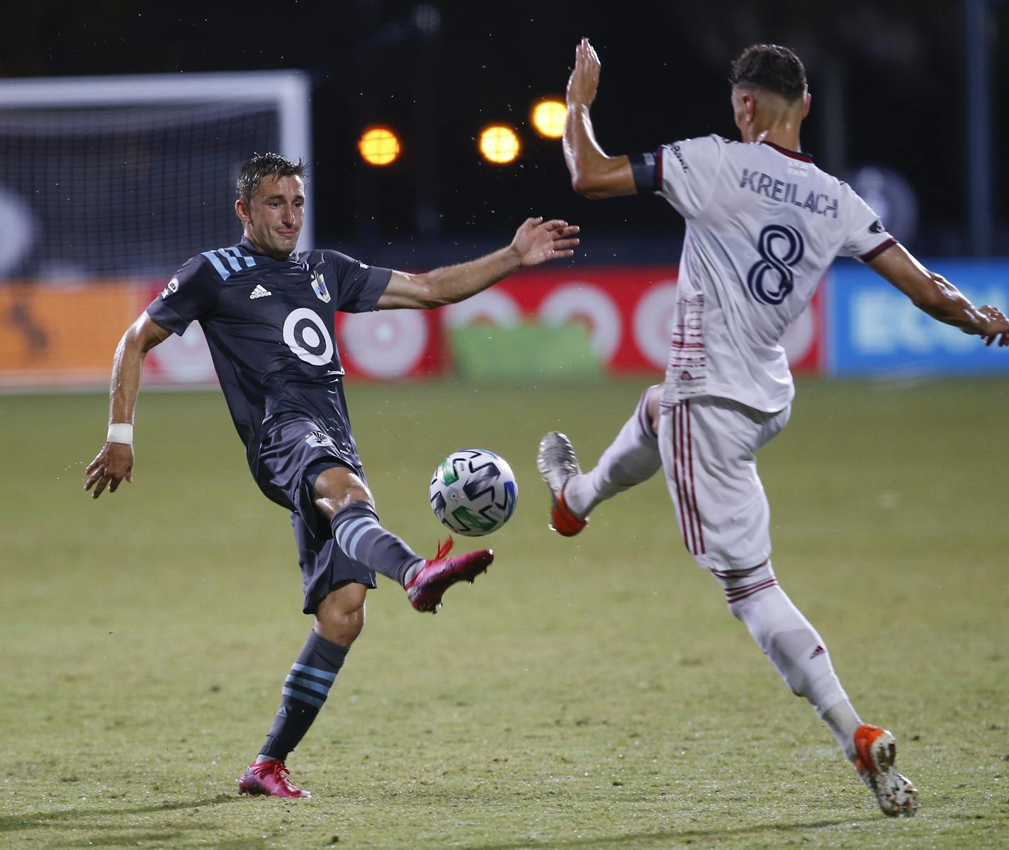 Minnesota United midfielder Jan Gregus, left, and Real Salt Lake midfielder Damir Kreilach (8) battle for the ball during the second half of an MLS soccer match in Kissimmee, Fla., early Saturday, July 18, 2020. (AP Photo/Reinhold Matay)