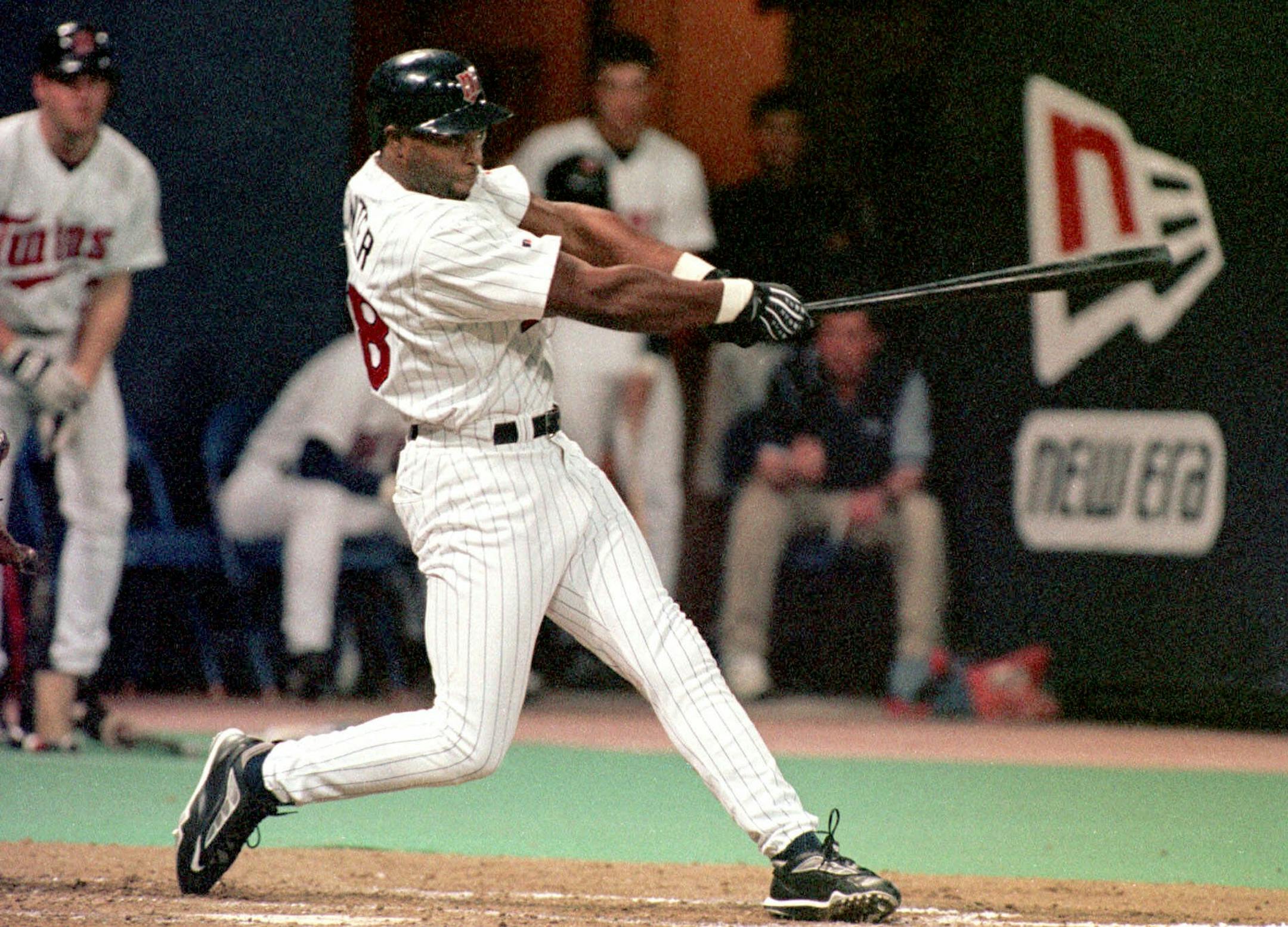 Minnesota Twins outfielder Torii Hunter drives the ball into left-center field for a grand slam home run during the fourth inning off Boston Red Sox pitcher Tim Wakefield, Monday, April 26, 1999, in Minneapolis. On base and scoring on the play were teammates Ron Coomer, Chad Allen, and Matt Lawton. Hunter went two for three with five RBIs for the night. The Twins beat the Red Sox 6-2.(AP Photo/Paul Battaglia)