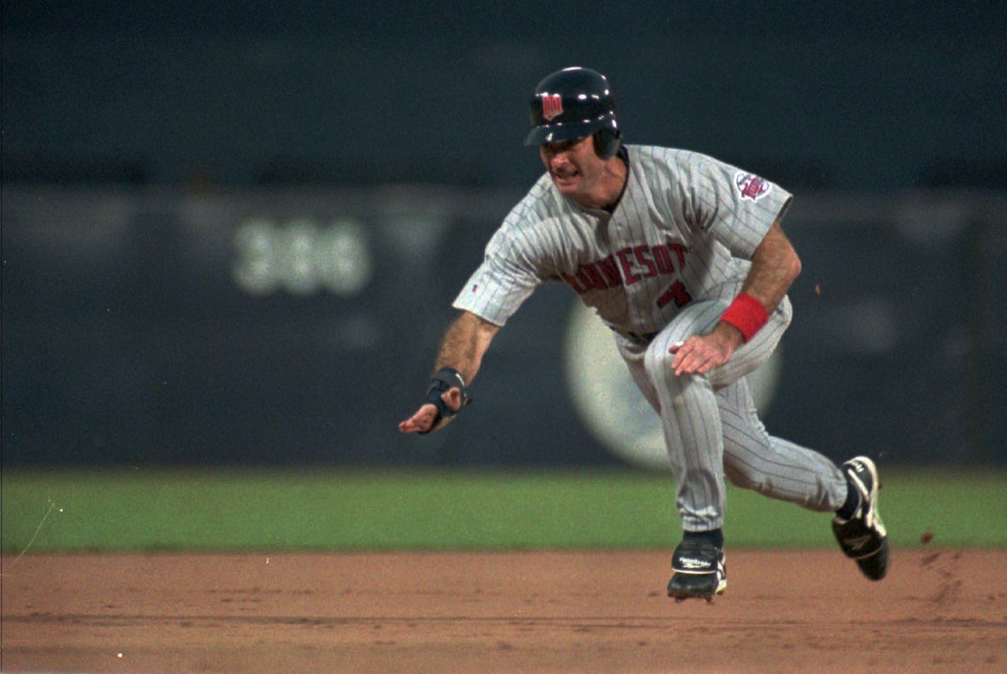 Minnesota Twins designated hitter Paul Molitor advances to third on a wild pitch in the first inning at Anaheim Stadium in a contest against the California Angels, Wednesday, Aug.7, 1996. (AP Photo/Tammy Lechner)