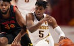 Minnesota guard Marcus Carr (5) drove to the basket as Maryland forward Donta Scott (24) raced to defend in the second half. ] ANTHONY SOUFFLE • ant