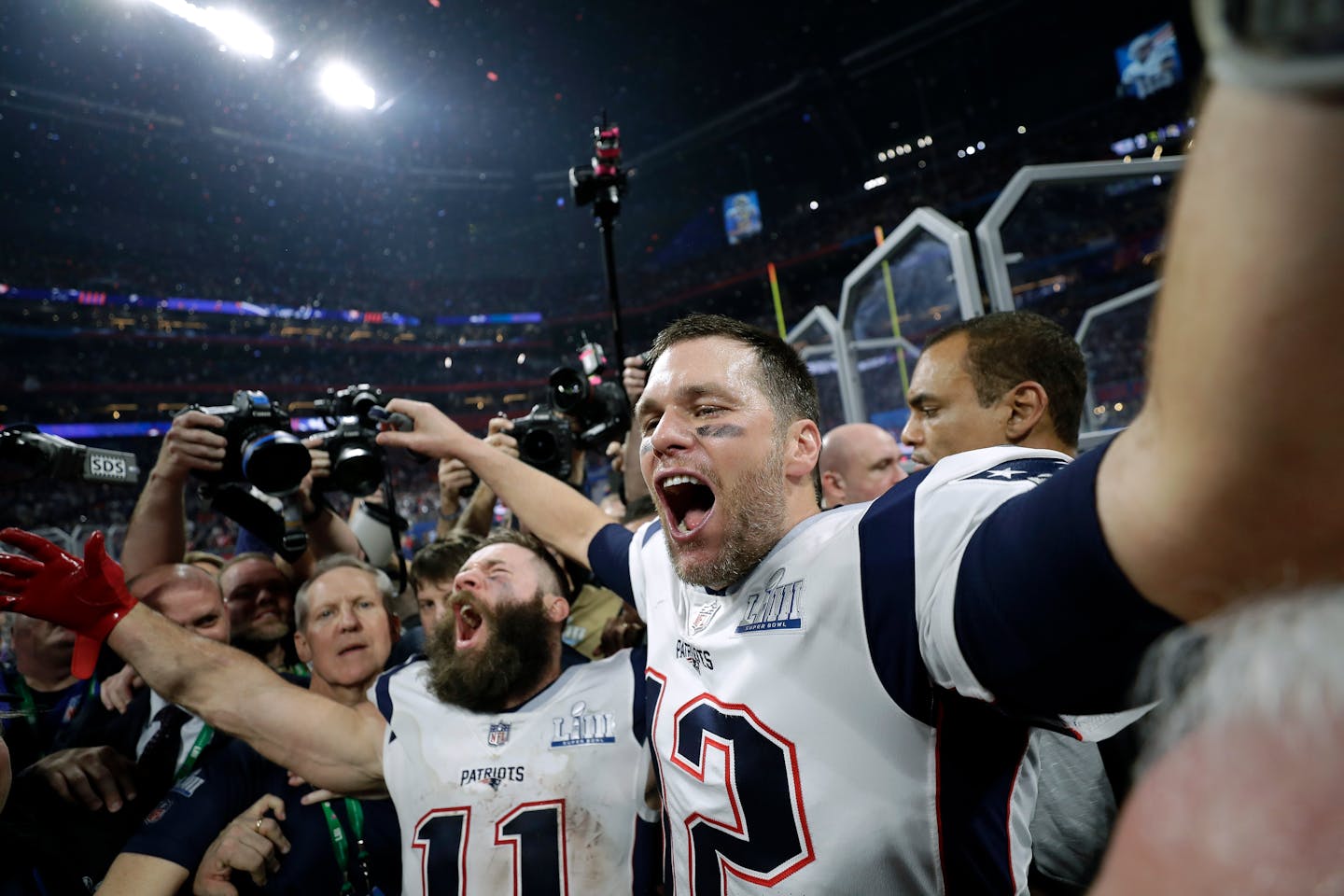 Patriots wide receiver Julian Edelman, left, and quarterback Tom Brady celebrated after beating the Rams 13-3 in Super Bowl LIII on Sunday. Edelman was named Most Valuable Player.