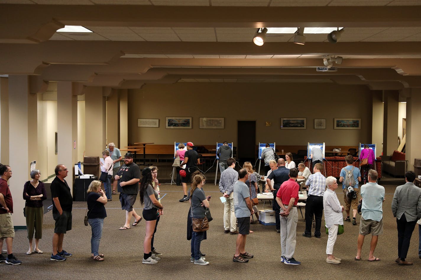 Voters lined up to get their ballots on primary election day at Holy Spirit Catholic Church in St. Paul.