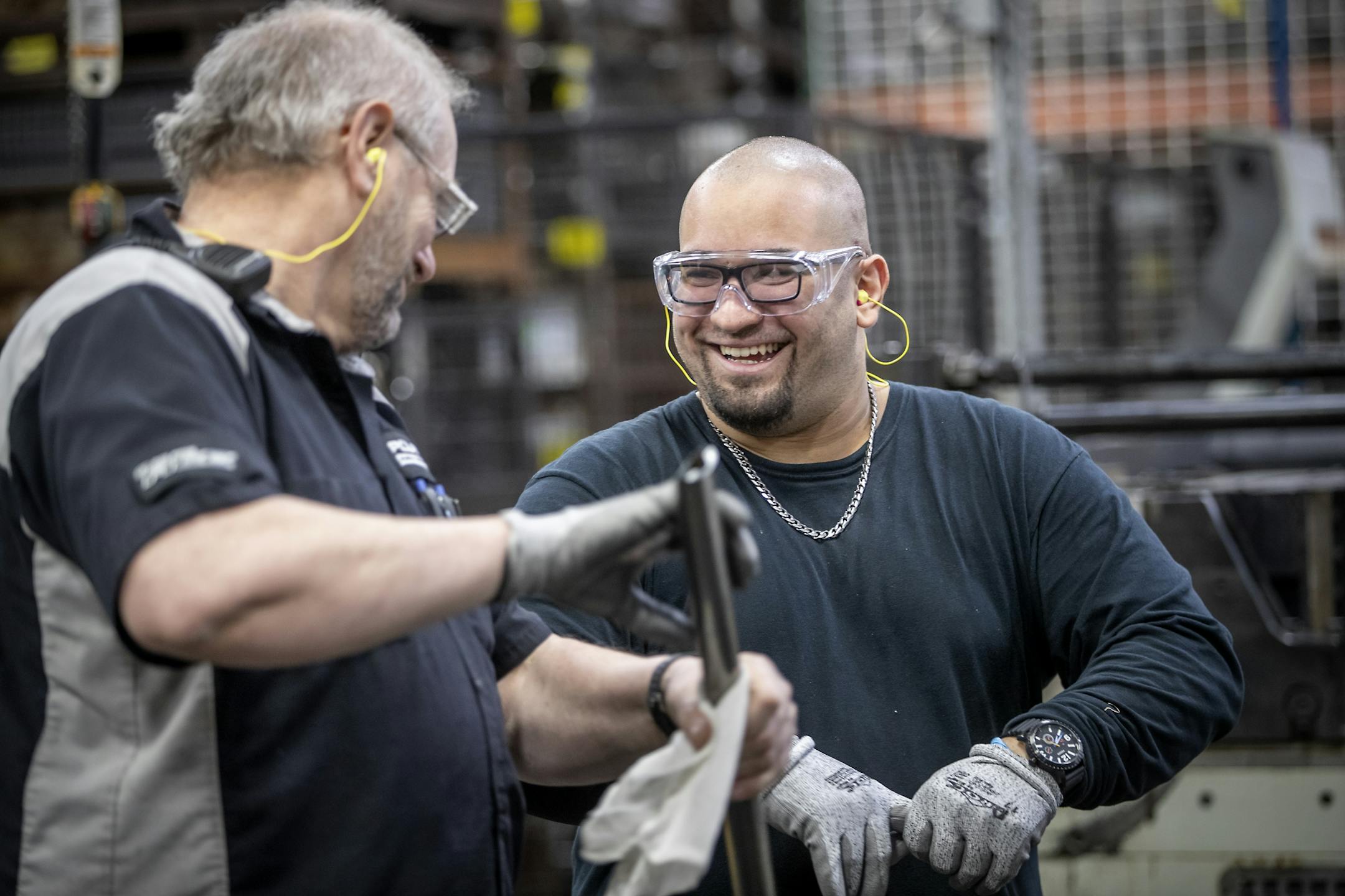 Scott Guenin, left, trained Alexei Berrios, 29, at the Polaris manufacturing plant, Monday, February 17, 2020 in Roseau, MN.
