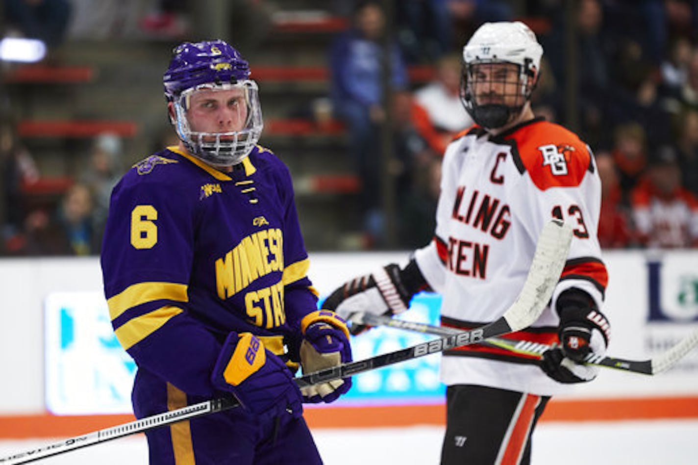 Minnesota State forward Parker Tuomie (6) and Bowling Green forward Stephen Baylis (13) reacts during an NCAA college hockey game, Saturday, Dec. 15, 2018, in Bowling Green, Ohio. (AP Photo/Rick Osentoski)