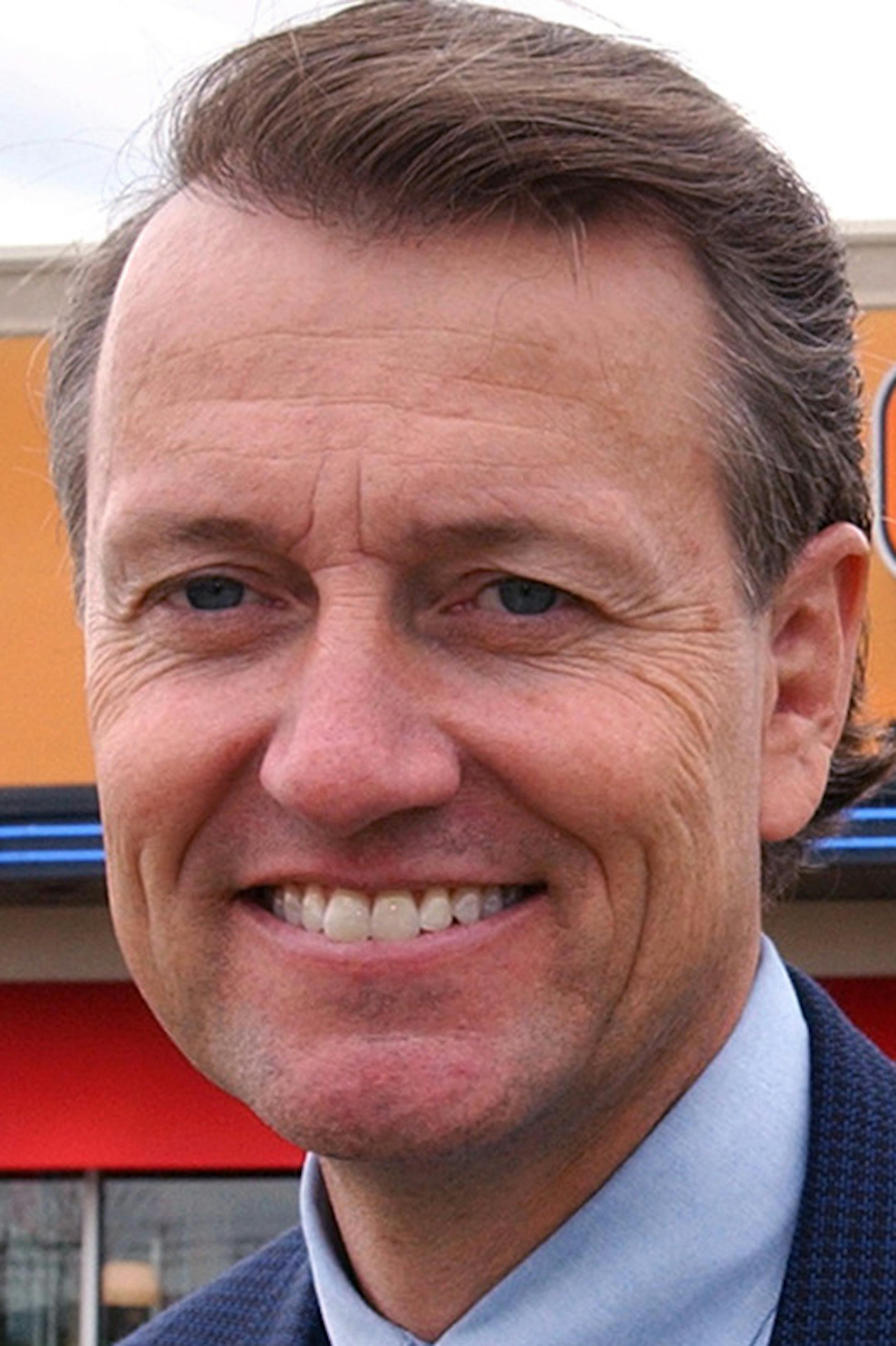 Coon Rapids, Mn., Tues., May 6, 2003--DQ Chief Executive Chuck Mooty stands outside the new DQ Grill & Chill in Coon Rapids. GENERAL INFORMATION: Dairy Queen's new Grill & Chill has opened in Coon Rapids. ORG XMIT: MIN2013081514594241