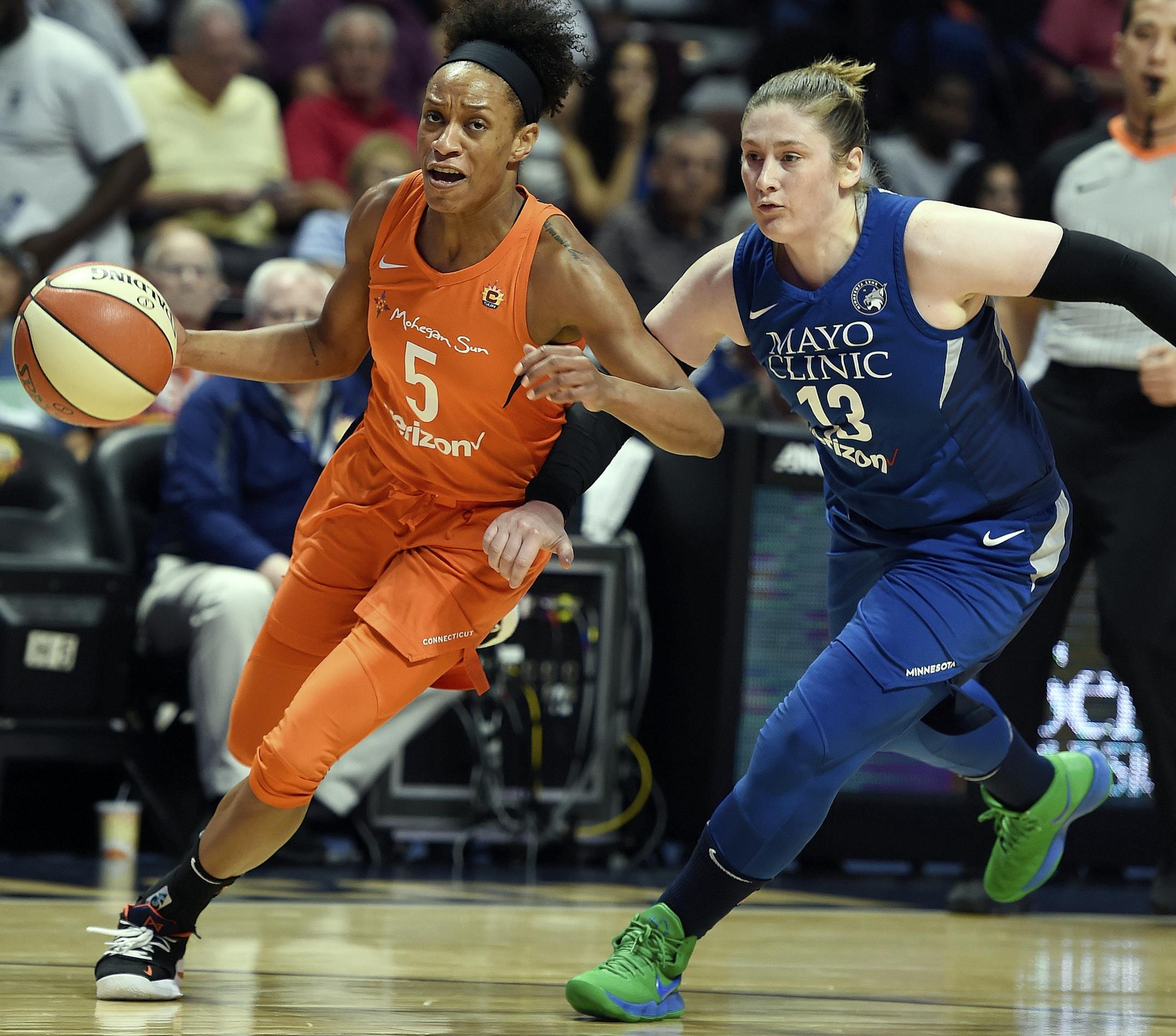 Connecticut Sun guard Jasmine Thomas drives by Minnesota Lynx guard Lindsay Whalen during the first half of a WNBA basketball game Friday, Aug. 17, 2018, in Uncasville, Conn. (Sean D. Elliot/The Day via AP)