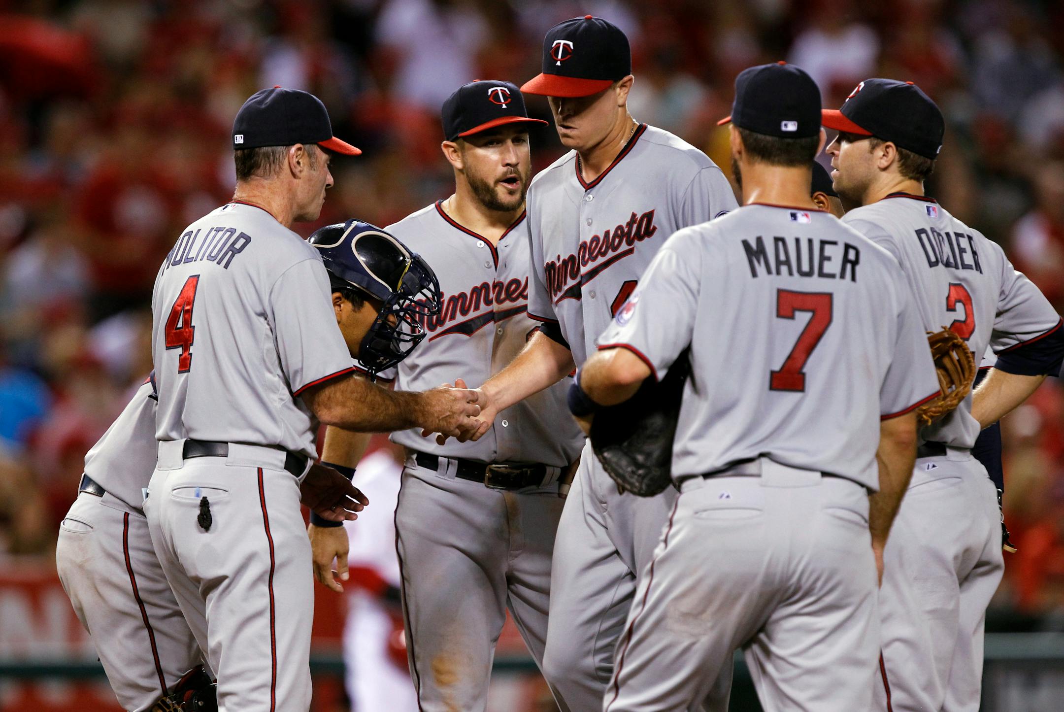 Minnesota Twins manager Paul Molitor (4) removes starting pitcher Kyle Gibson, center, during the sixth inning of a baseball game against the Los Angeles Angels in Anaheim, Calif., Tuesday, July 21, 2015. (AP Photo/Alex Gallardo)