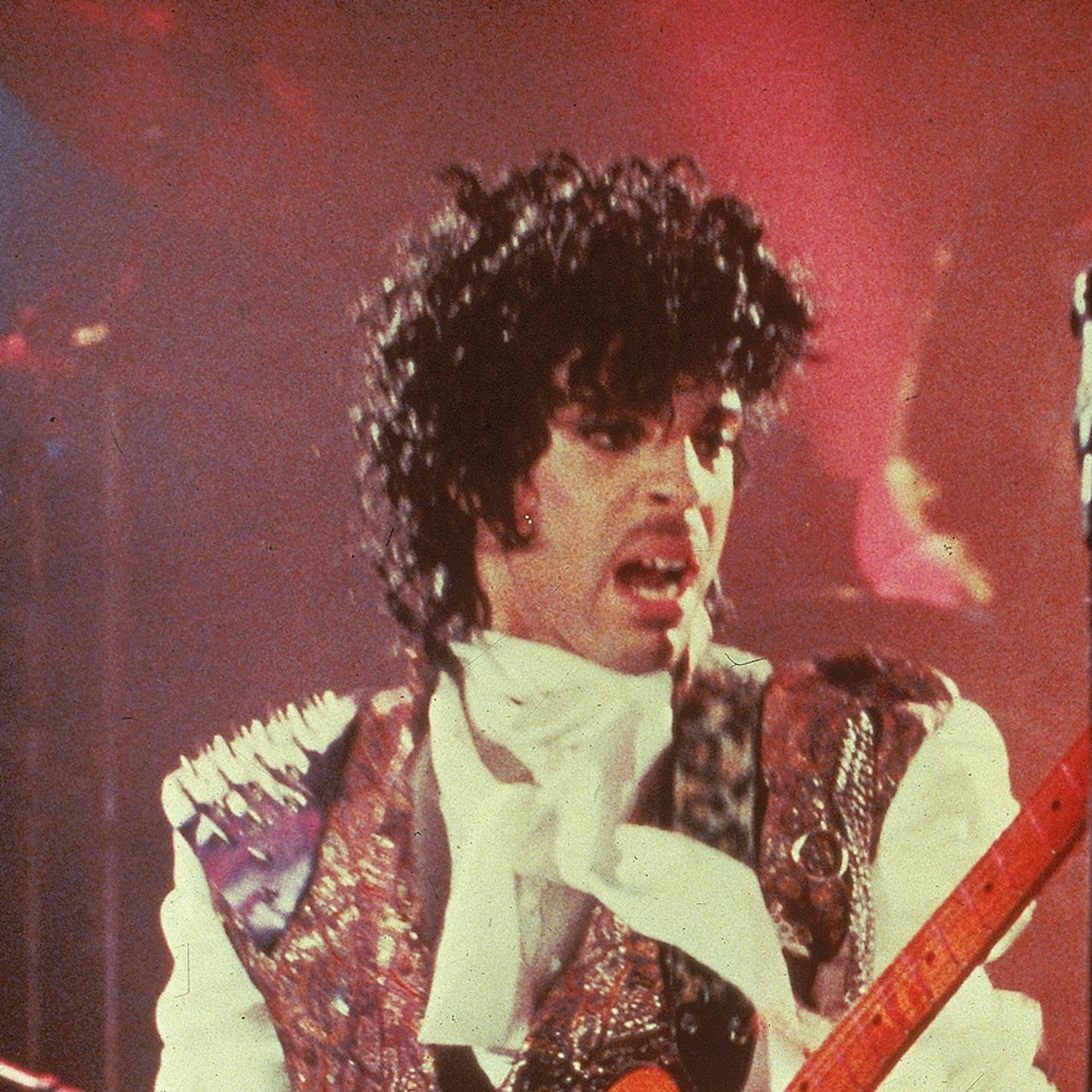 Prince performs in his debut movie "Purple Rain," the 1984 rock opera about a young man's search for artistic accomplishment and love. (AP Photo) ORG XMIT: MIN2013070317435669 ORG XMIT: MIN1307031749201668