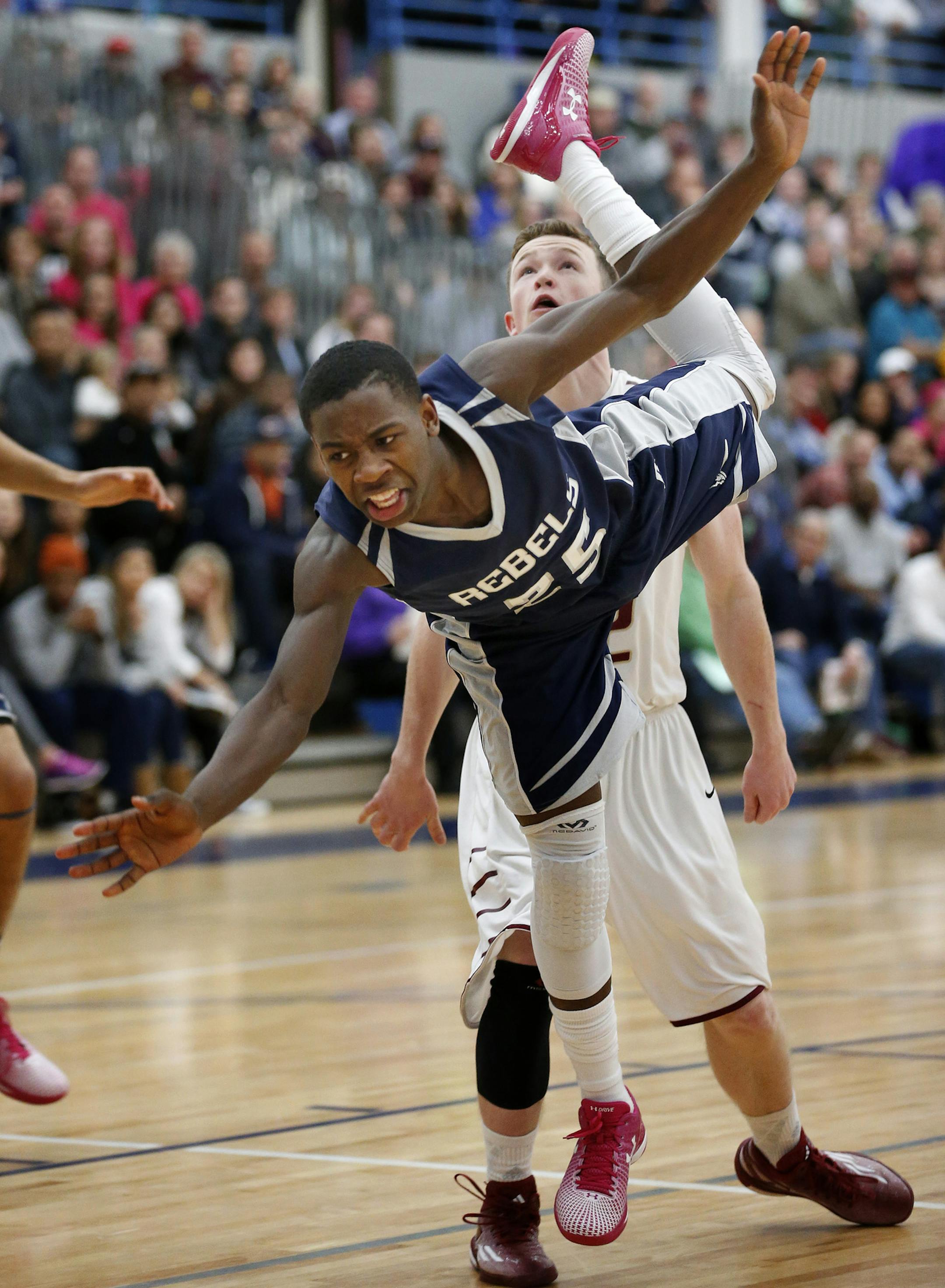 McKinley Wright (25) of Champlin Park fell after attempting a shot in the first half. ] CARLOS GONZALEZ cgonzalez@startribune.com, January 20, 2015, Champlin Park, Minn., Champlin Park High School, Prep Boys basketball, Champlin Park vs. Maple Grove