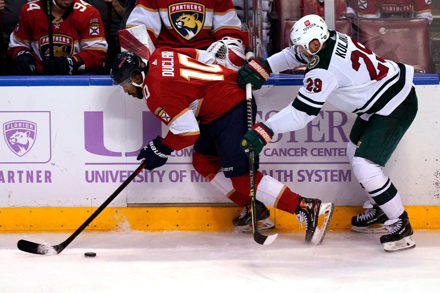 Minnesota Wild defenseman Dmitry Kulikov (29) pushes Florida Panthers left wing Anthony Duclair (10) during the second period at an NHL hockey game, Saturday, Nov. 20, 2021, in Sunrise, Fla. (AP Photo/)