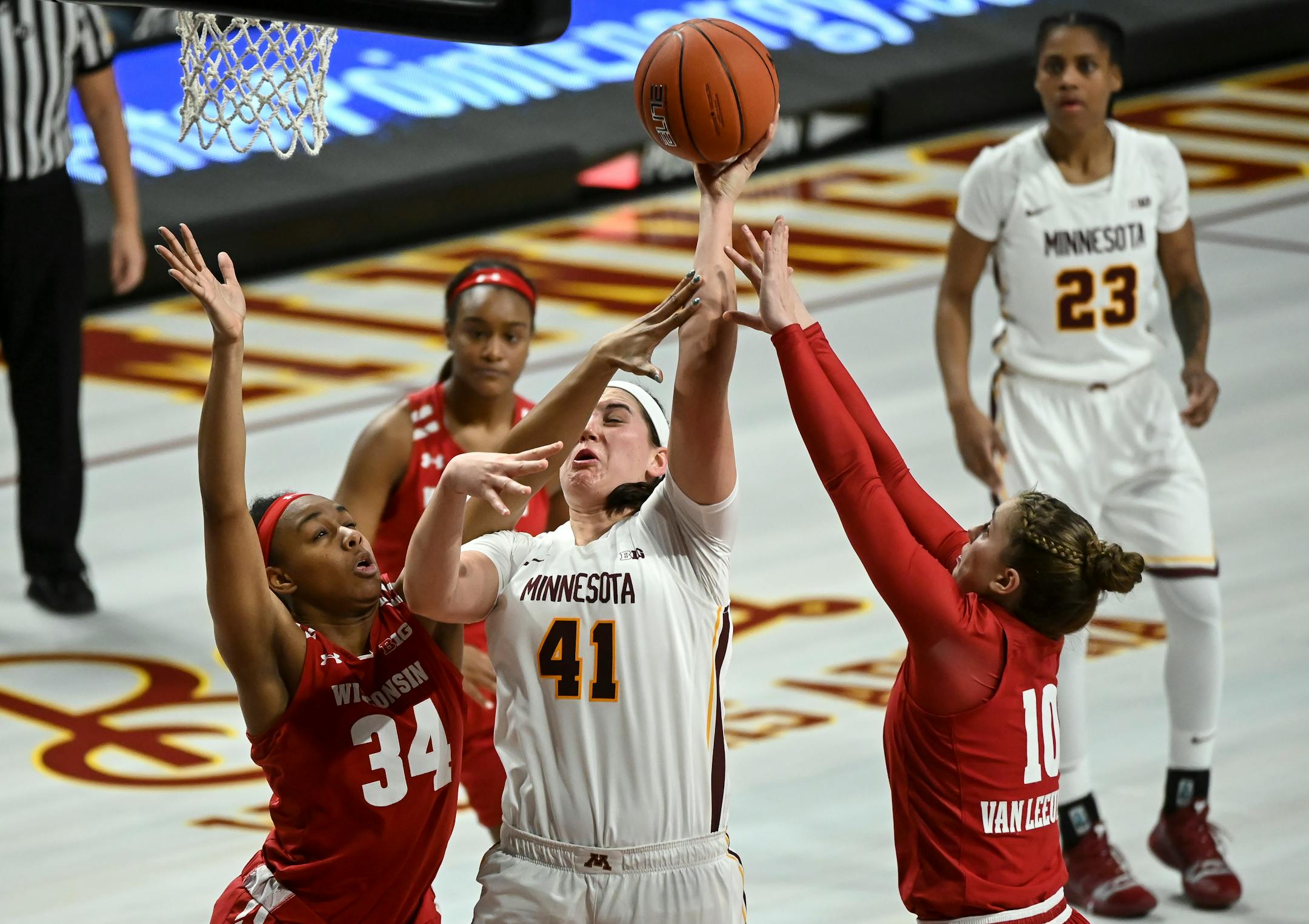 Gophers center Annalese Lamke scored a basket despite contact from Badgers forward Imani Lewis in the third quarter Friday night.